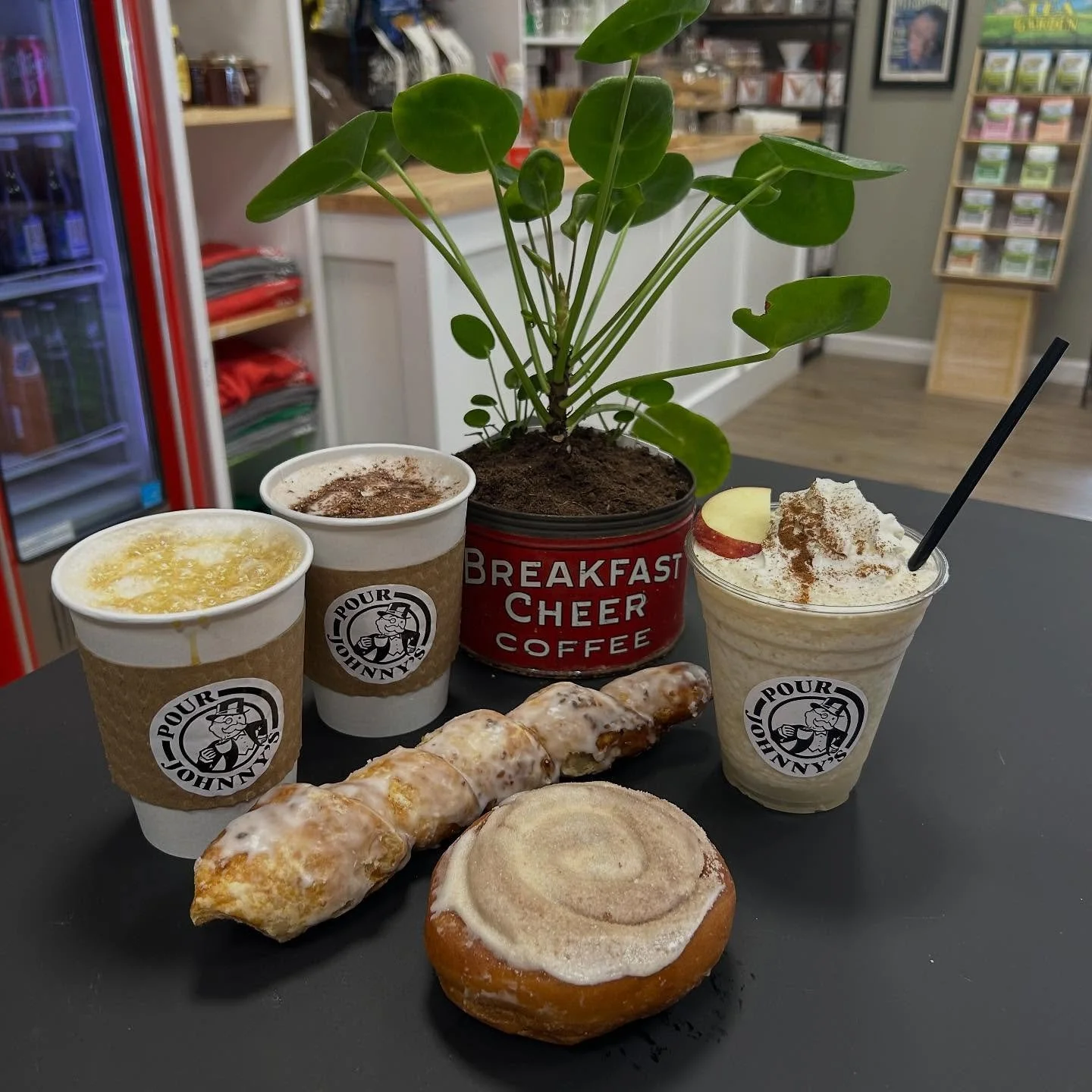 Sunday in the shop.  Brown Sugar Cinnamon latte, steamed milk hot chocolate and whipped apple cider with a fresh cinnamon roll and snuggie from our friends at @cibronesbakery.  Open daily:  Monday - Friday 6 am - 2pm, Saturday 8 am - 2 pm, Sunday 10 