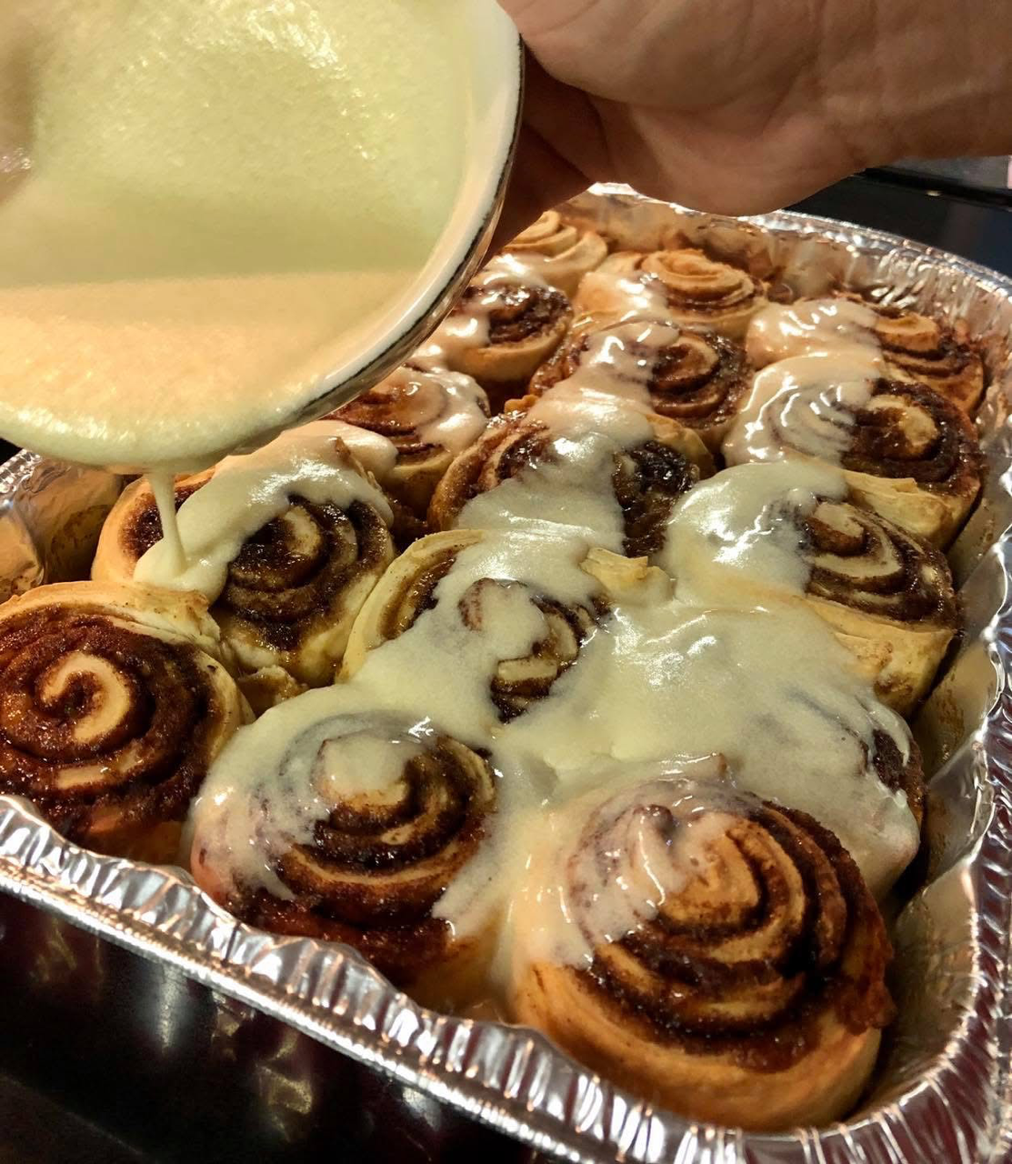 cinnamon rolls with orange glaze.png
