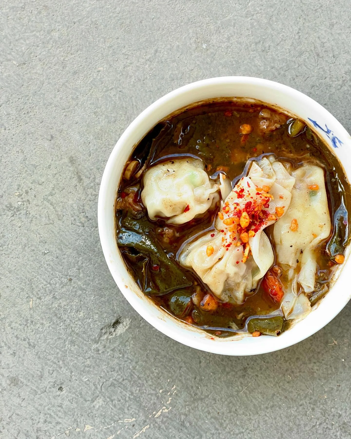 PRACTICING THAT PERFECT PLATE UP FOR @highlandsfoodandwine 
Good gumbo is a hug for your insides and this one holds on tight. 
Smoked pork and collard green gumbo with smoked pork dumplings. It&rsquo;s even more of a banger than I thought it might be