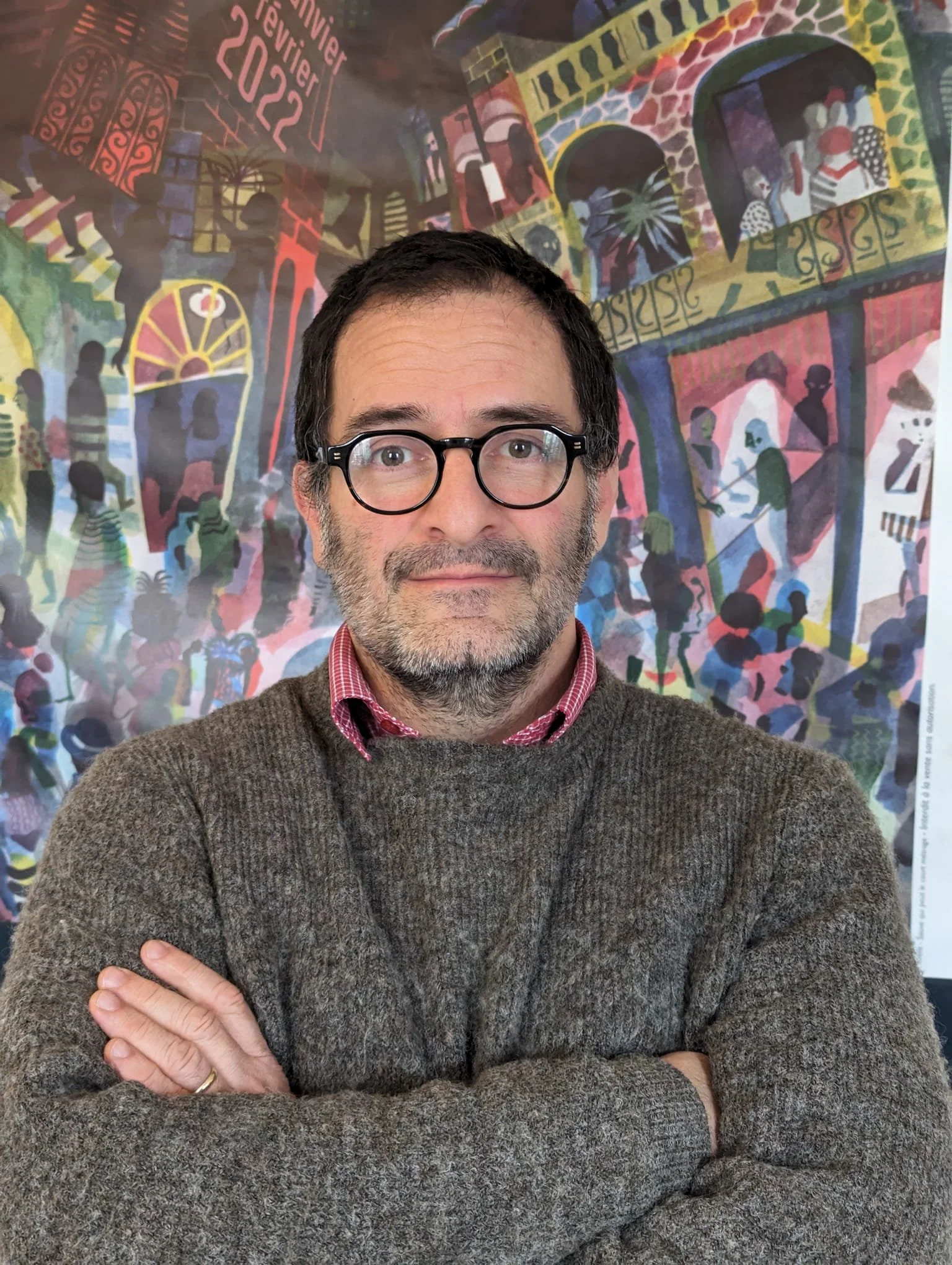 Black background with a large orange lowercase letter 'a' overlapping a smaller black lowercase letter 'a'.