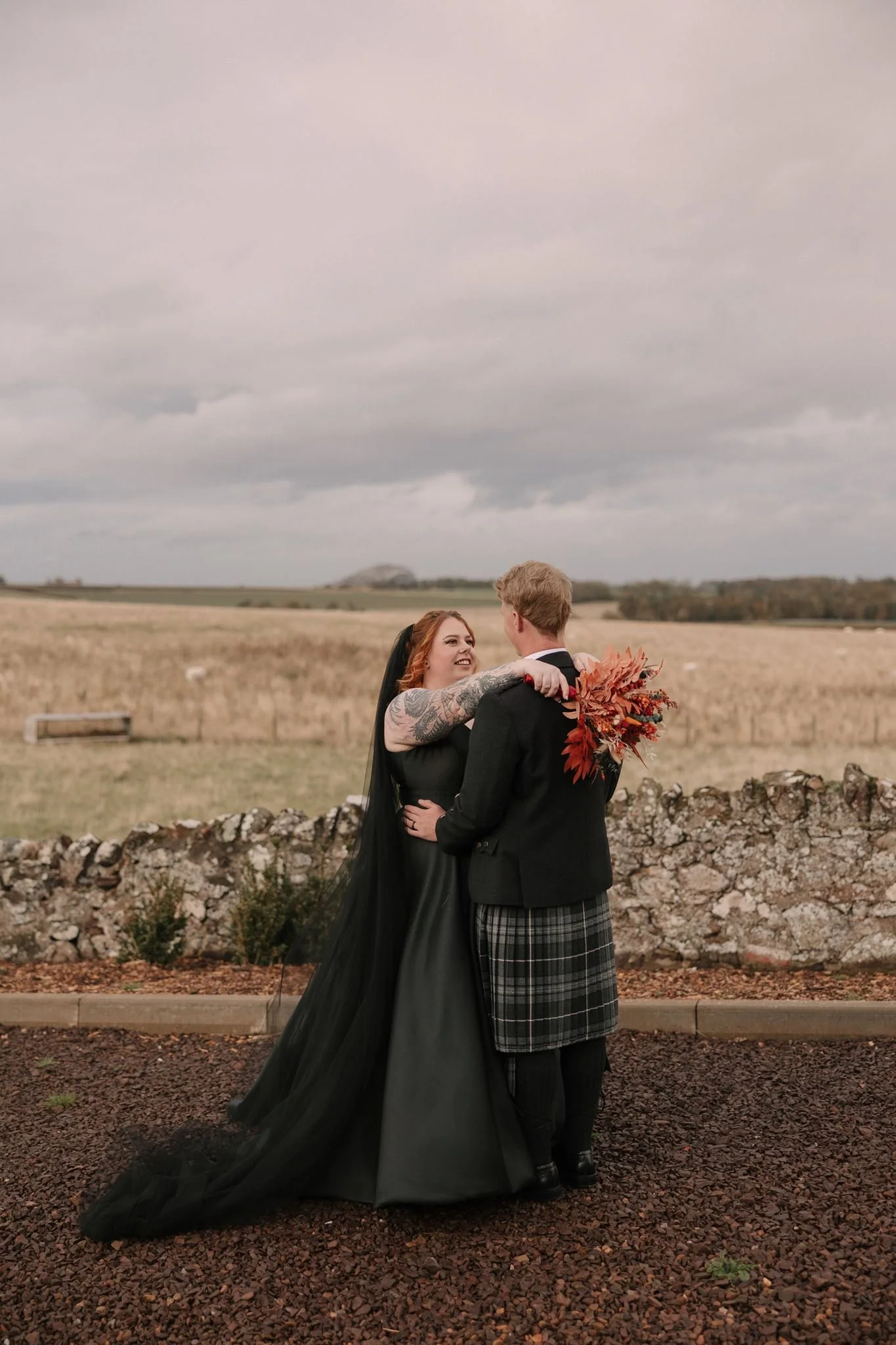 couple portrait of goth alternative bride and groom in Scotland wedding