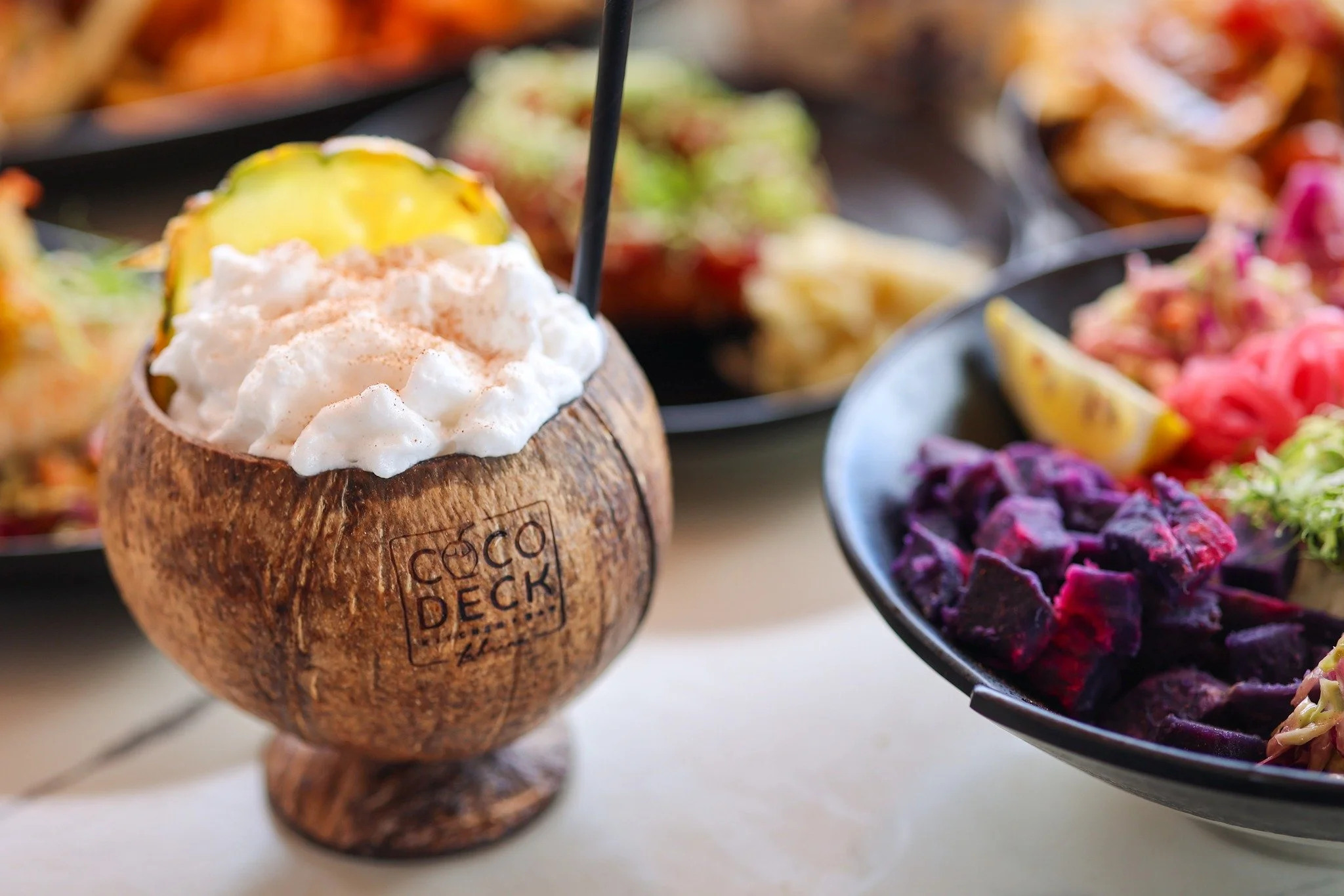 Hand-crafted cocktails in a coconut just feel like vacation. Stop in and try our signature Horchata Colada! Served all day. 🌊✨ 

#cocodecklahaina #cocodeck #lahaina #oceanfrontdining #mauirestaurant 
#maui #thekitchenassassin