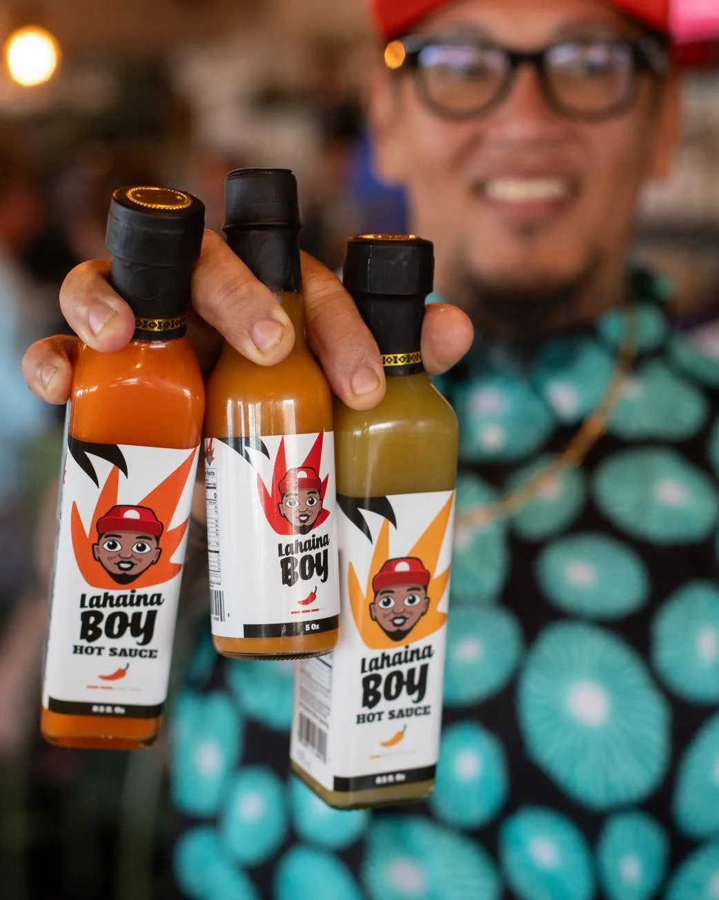 Pick your heat. Lahaina Boy hot sauces, always ready to level up your plate. Available for purchase in-house, online, at Hana Hou Hospitality locations, and at Island Grocery!
