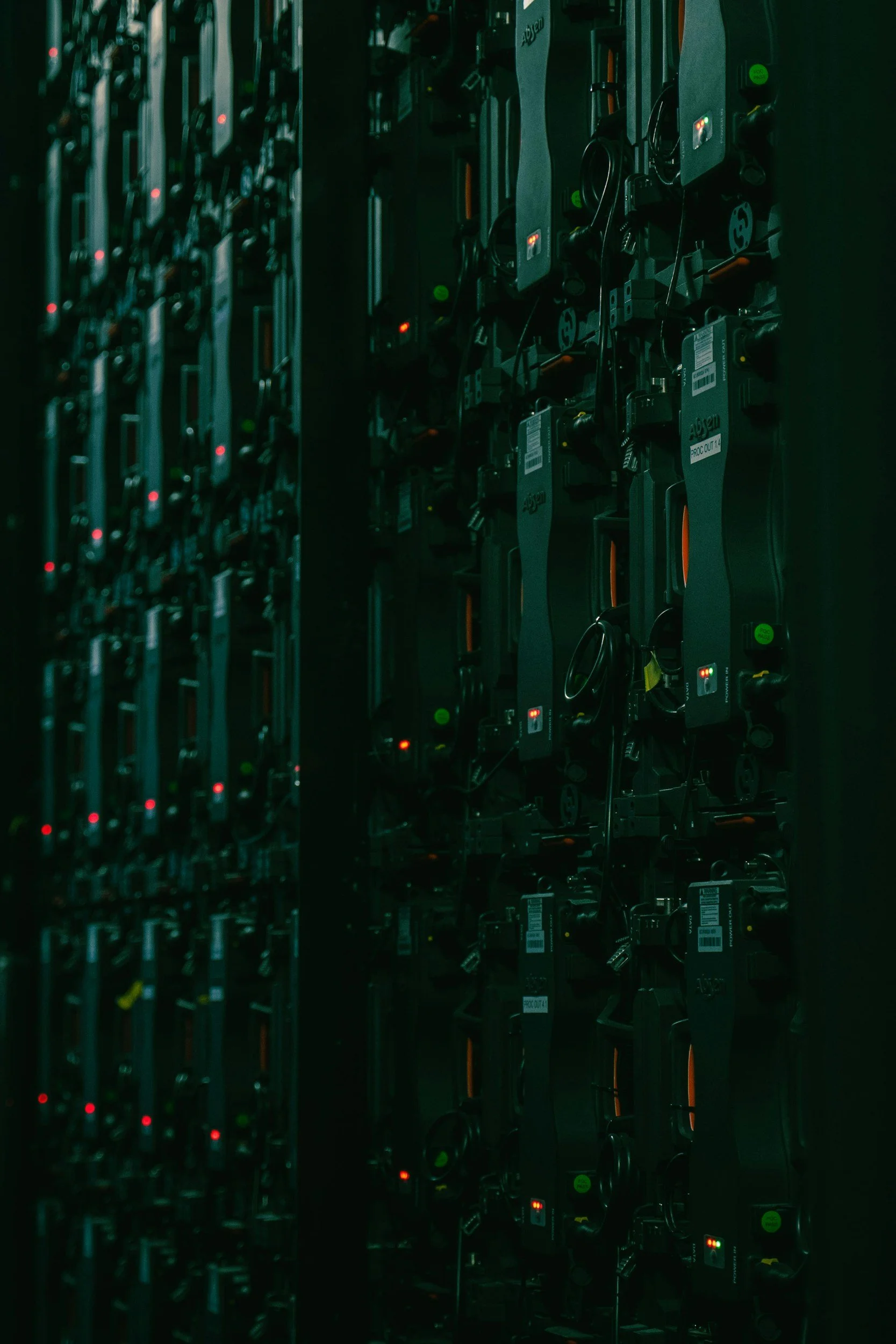 Fibre optic cables terminating into a patch panel in a building comms room