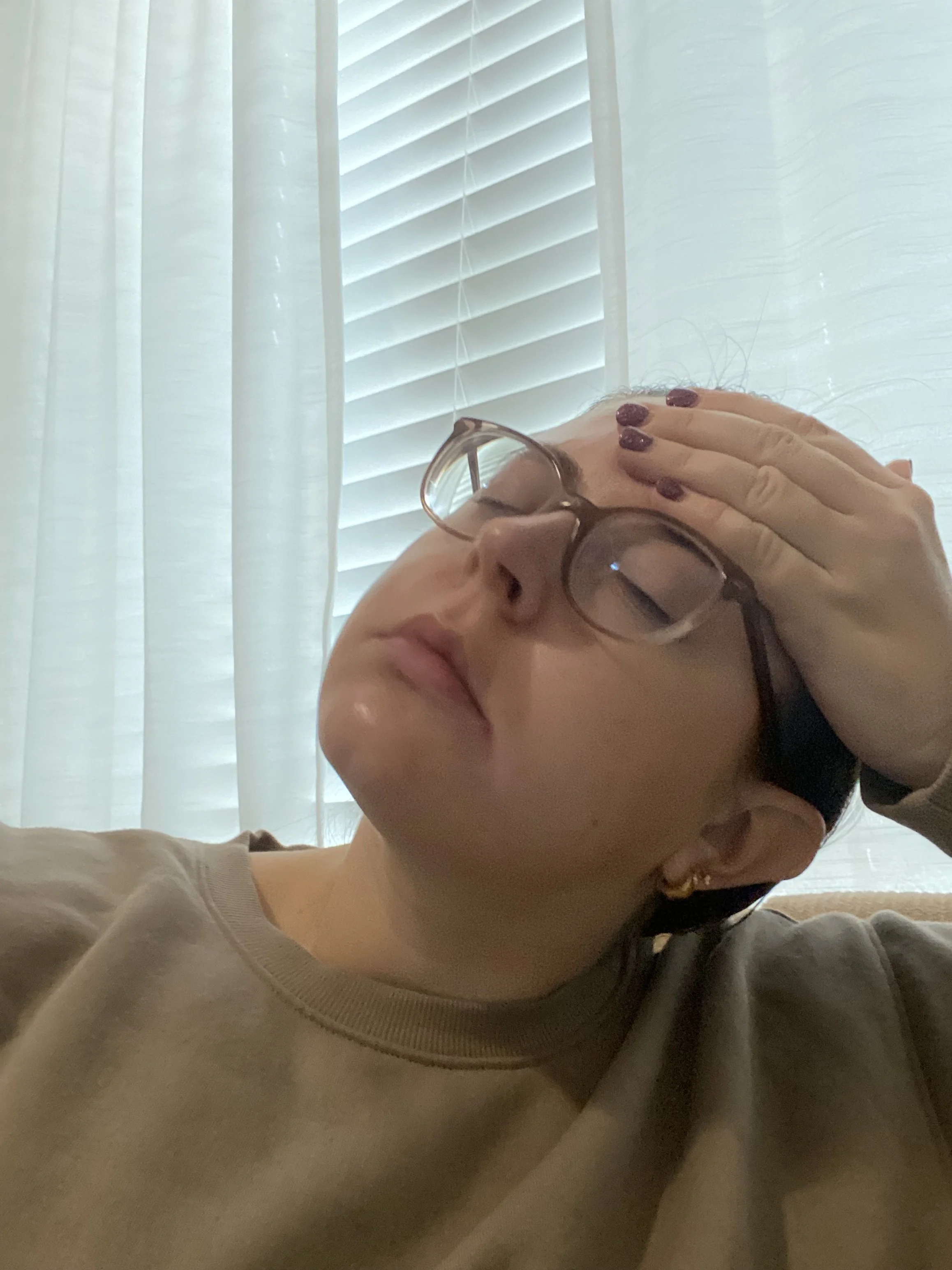 High achieving woman experiencing emotional overload, nervous system exhaustion, and burnout from chronic emotional labor