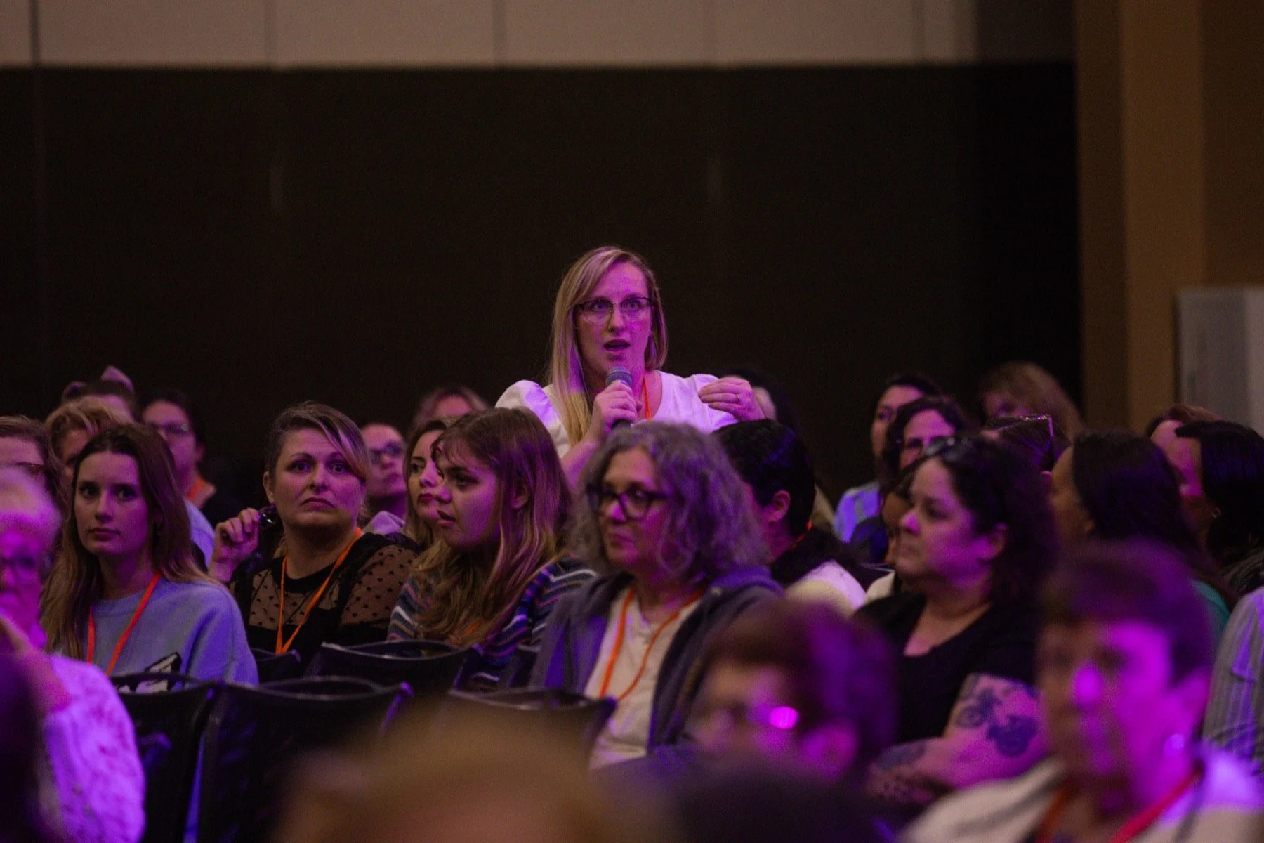 Women worshiping at a past MORE Conference