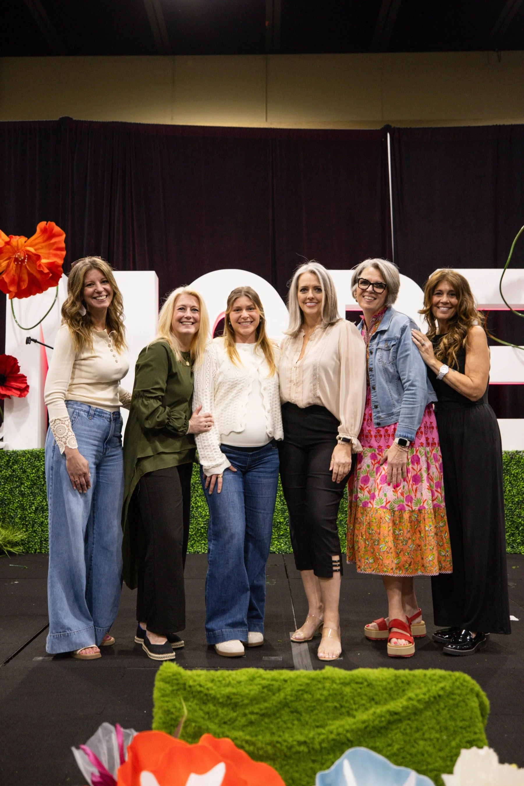 Speakers on stage at a past MORE Conference