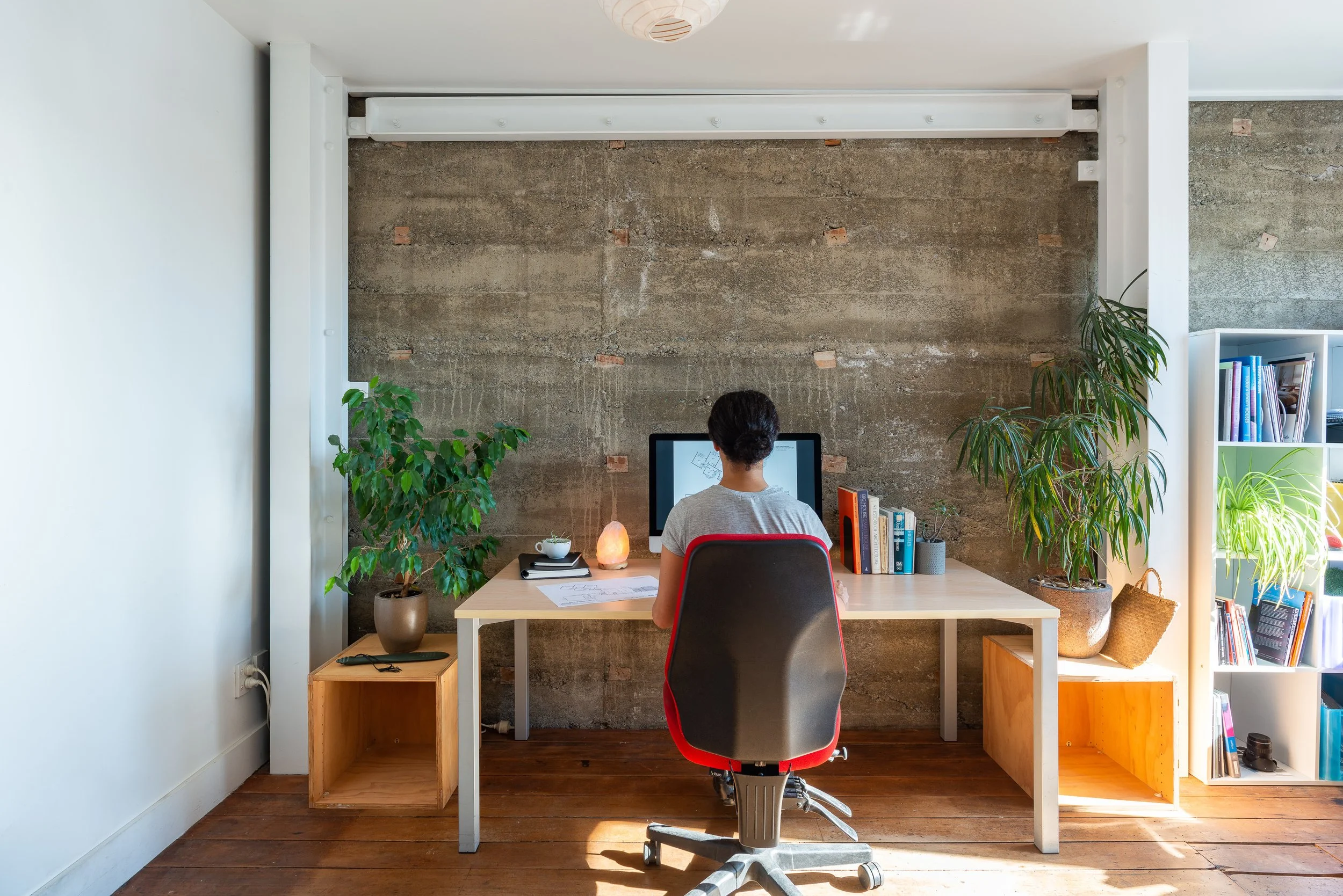 Our own office, upstairs from the open plan Bridge Street collective space; a workspace set up by brick wall, exposed steel portals, old rimu floor - the home of Waka Group Architects