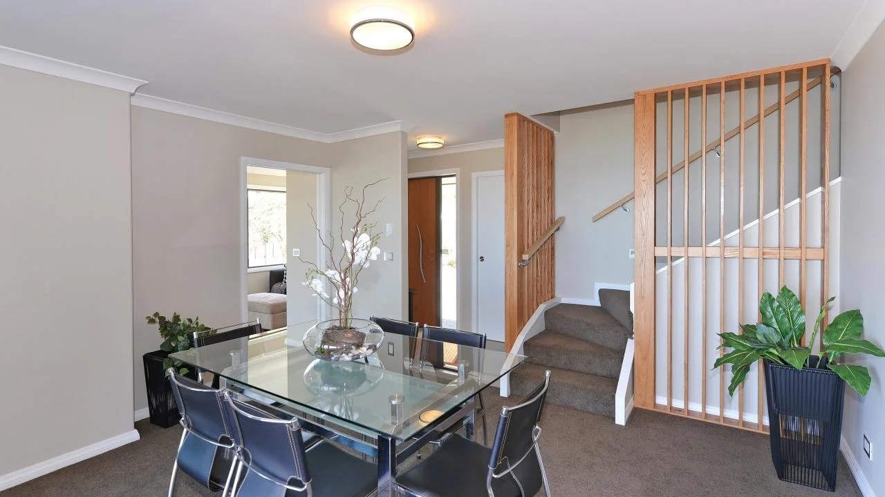 Dining room and stairs with vertical timber louvres