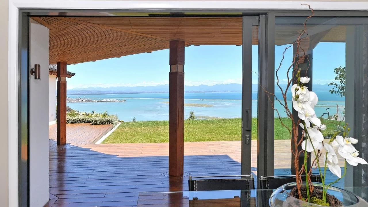 View from lower level onto front North facing deck out over Nelson Haven