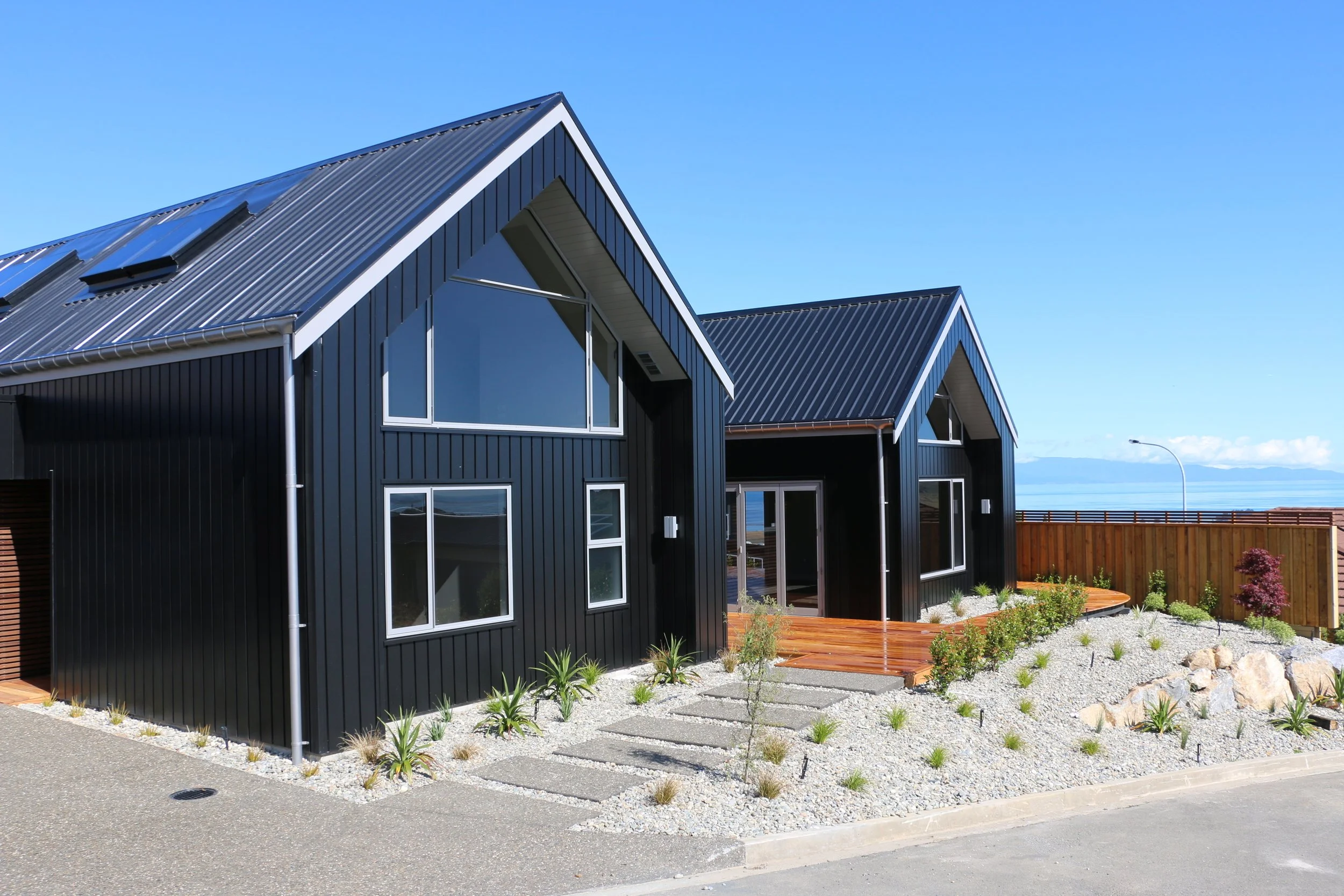 Double gabled black house overlooking Nelson, gable view, architect Keni-Duke Hetet
