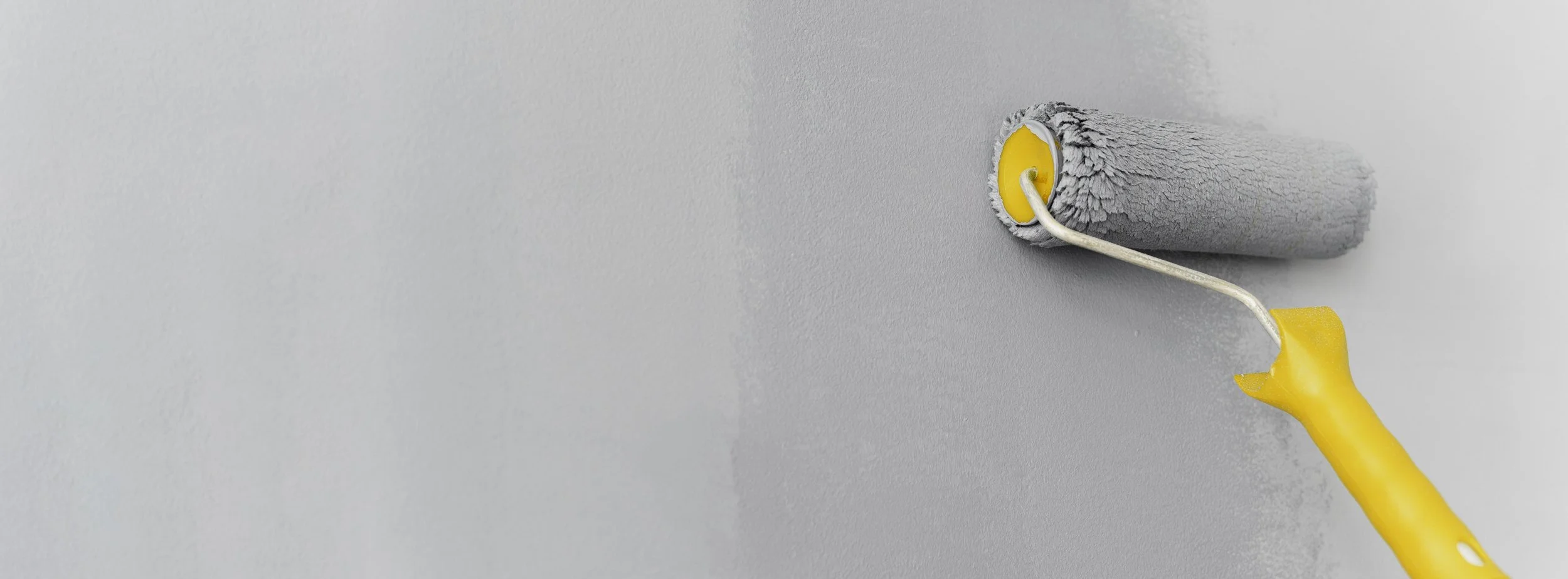 roller-painting-gray-wall.jpg
