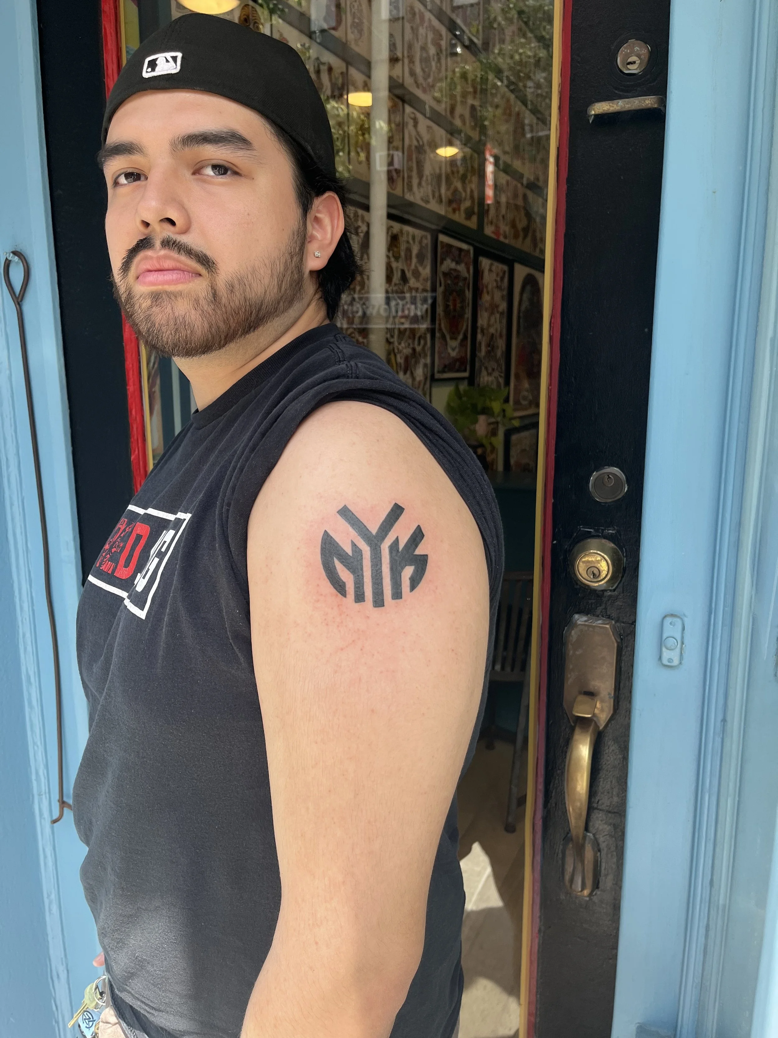 Julius-Forte-Tattoo-Portfolio-Brooklyn-NYK-Logo-Arm-Tattoo.jpg