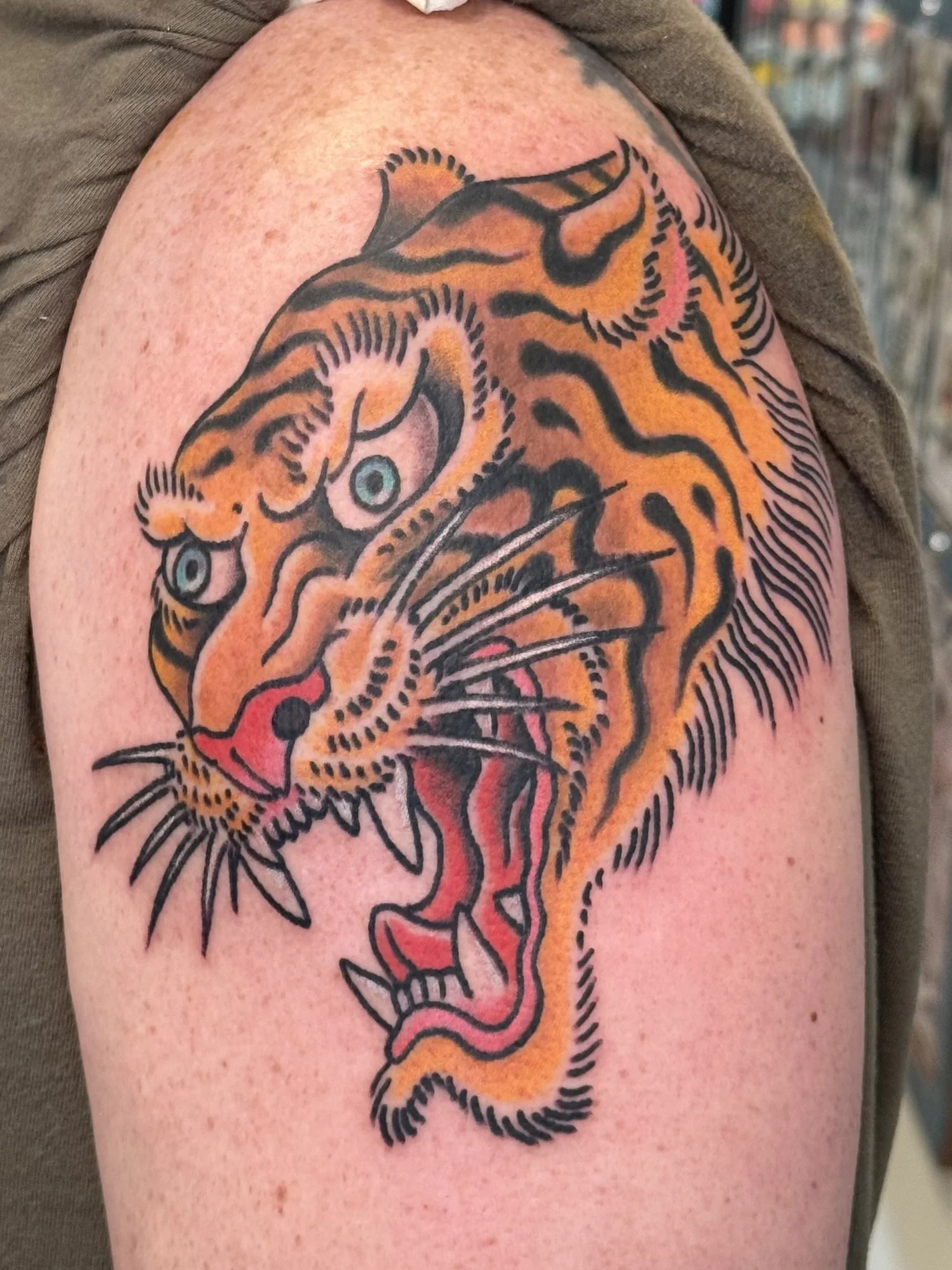 Roaring tiger head tattoo on a shoulder by Jae Connor.jpg