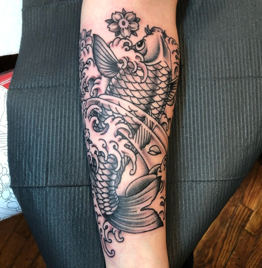 Japanese koi fish tattoo with waves on the forearm by Electric Lotus Tattoo in NYC
