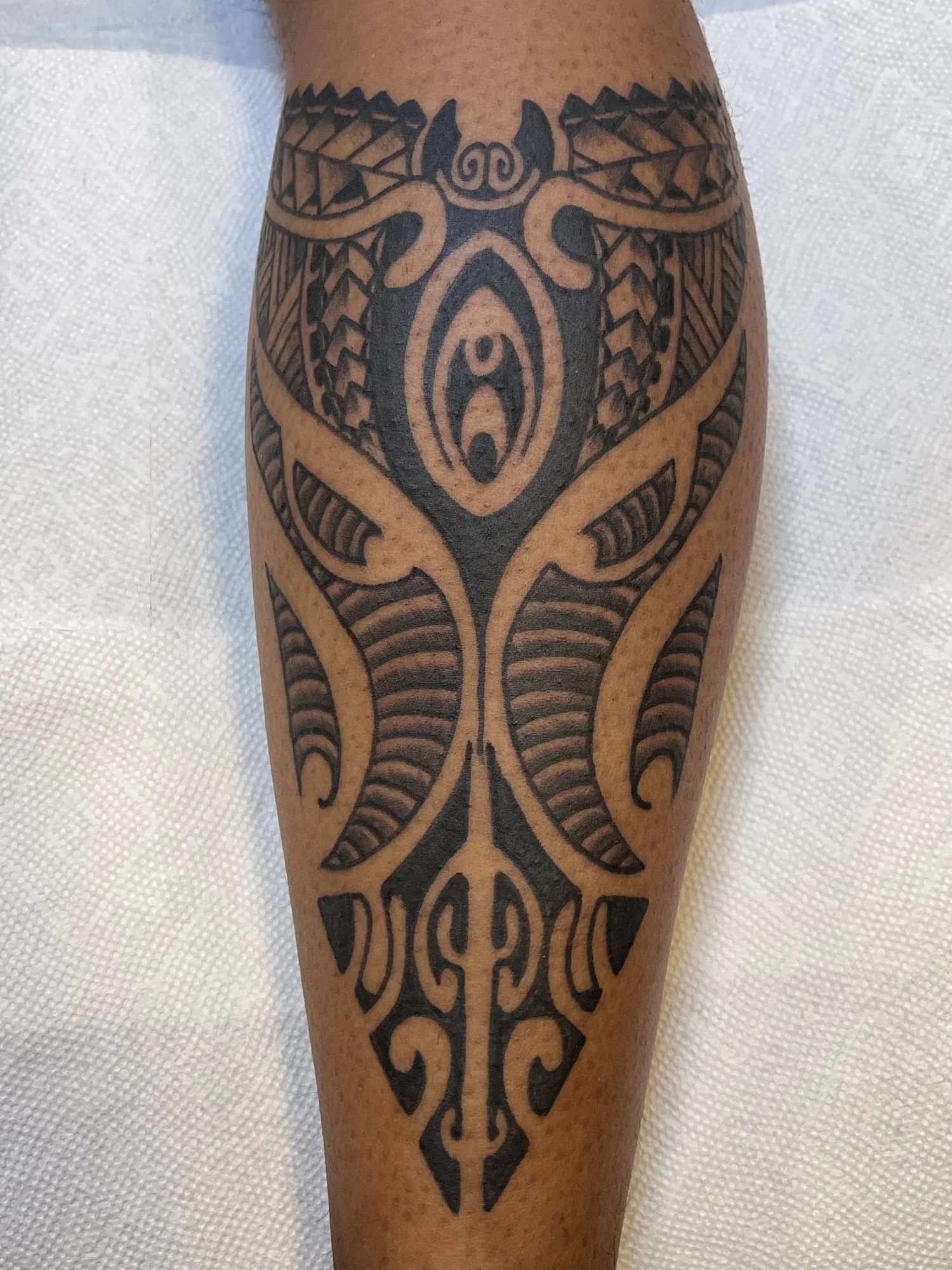 Polynesian style blackwork tattoo on a calf.jpg