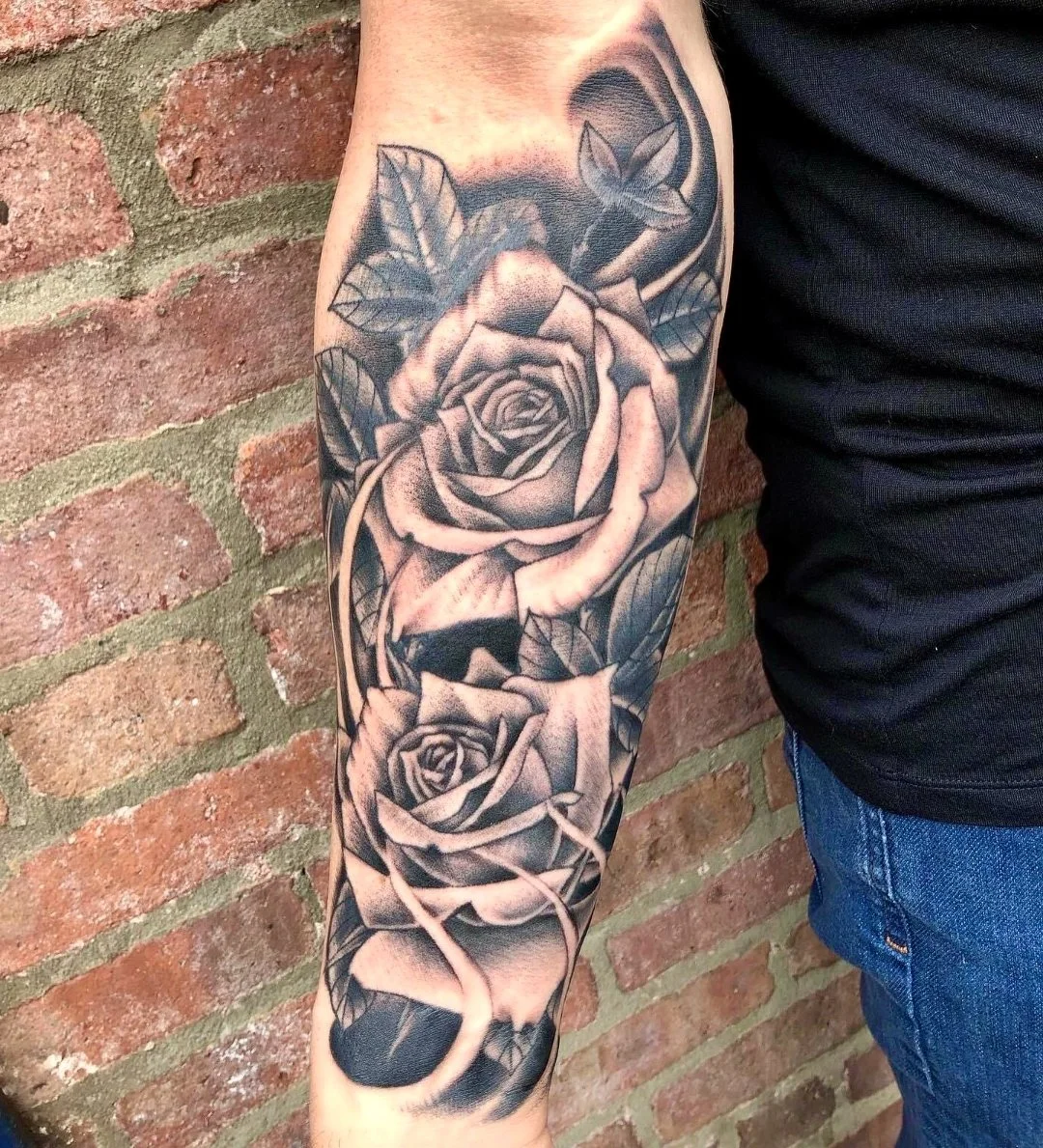 Black and grey realistic rose tattoo sleeve by Electric Lotus Tattoo in NYC