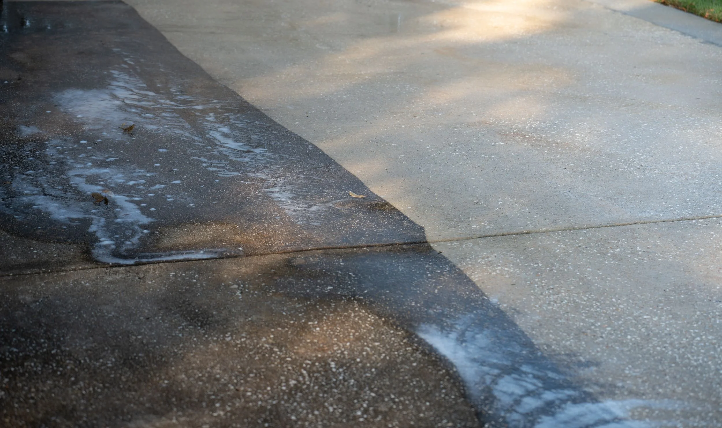 Cleaning a concrete patio with a surface cleaner in Miramar, FL