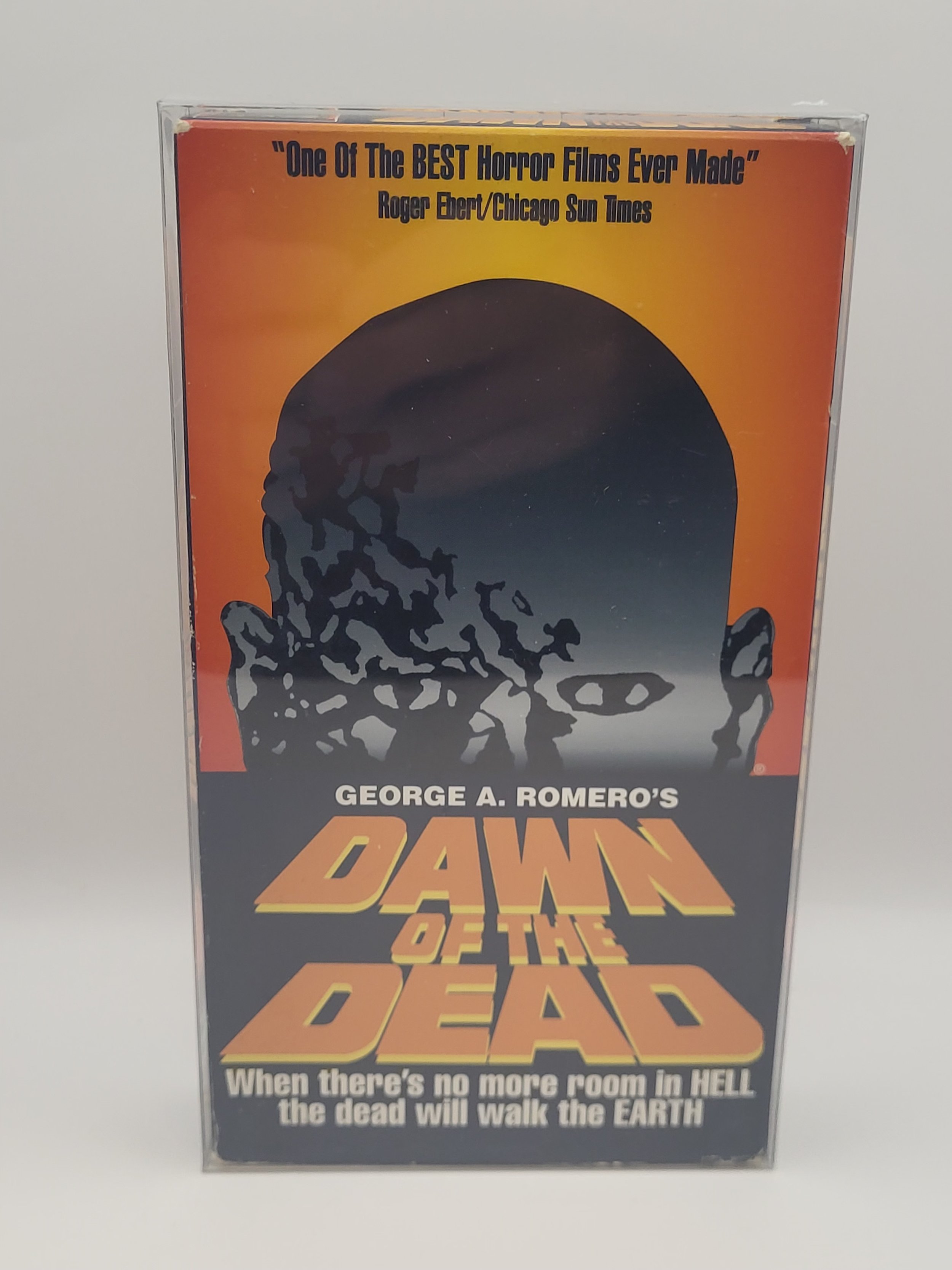 VHS tape of George A. Romero's 'Dawn of the Dead' with zombie artwork and horror film quote