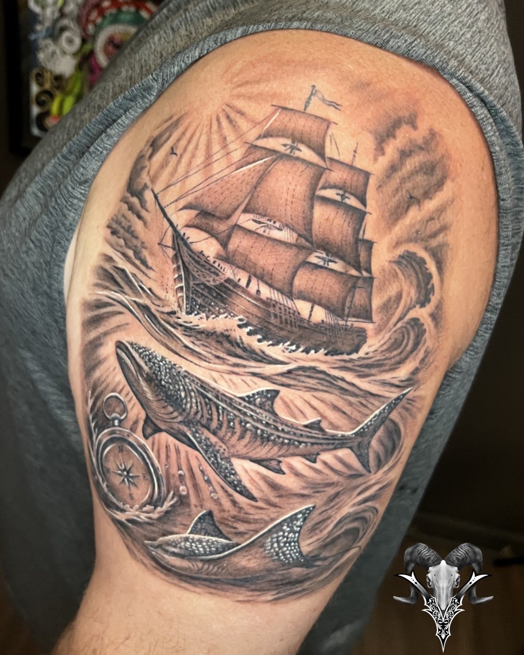 Black and grey sailing ship tattoo by Mi Vida Tattoos