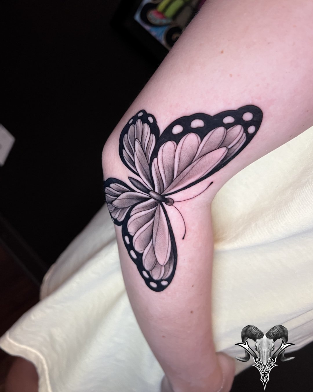 Black and grey butterfly tattoo by Mi Vida Tattoos