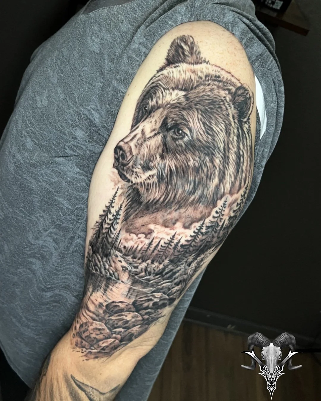 Black and grey bear and mountain landscape tattoo by Jose Lopez at Mi Vida Tattoos