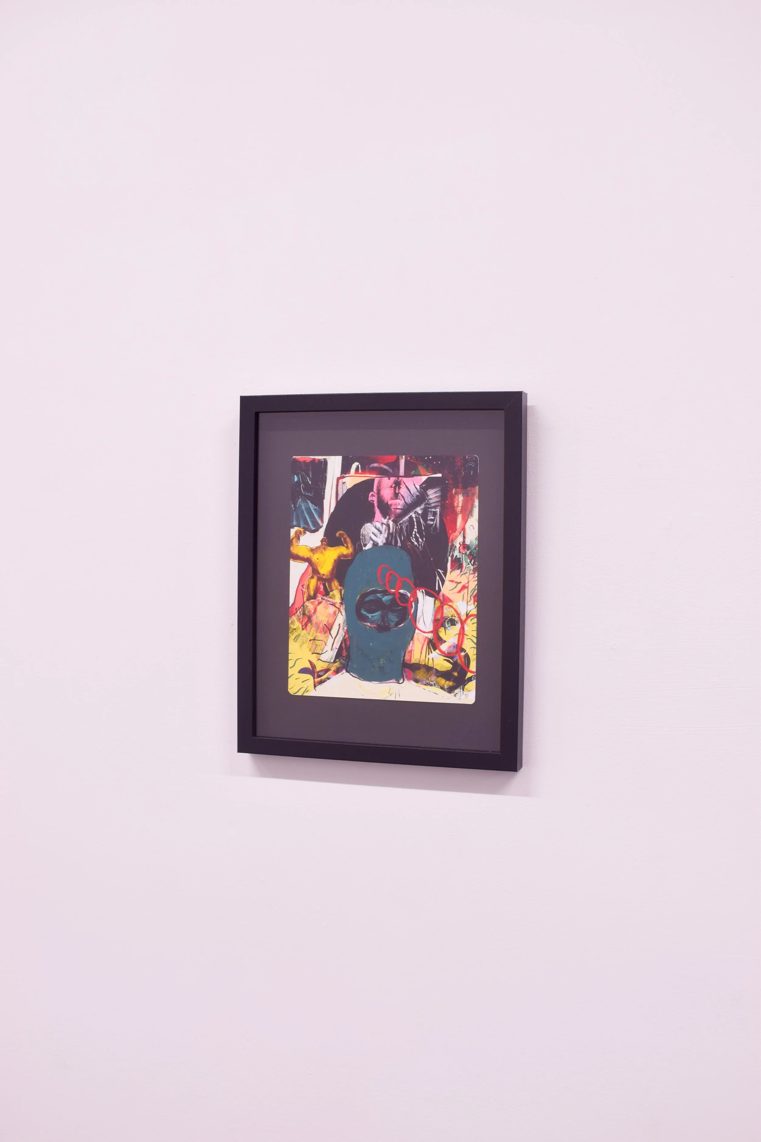 A framed colorful illustration on a white gallery wall, depicting a person with a blue face, red glasses, surrounded by abstract and figurative elements.