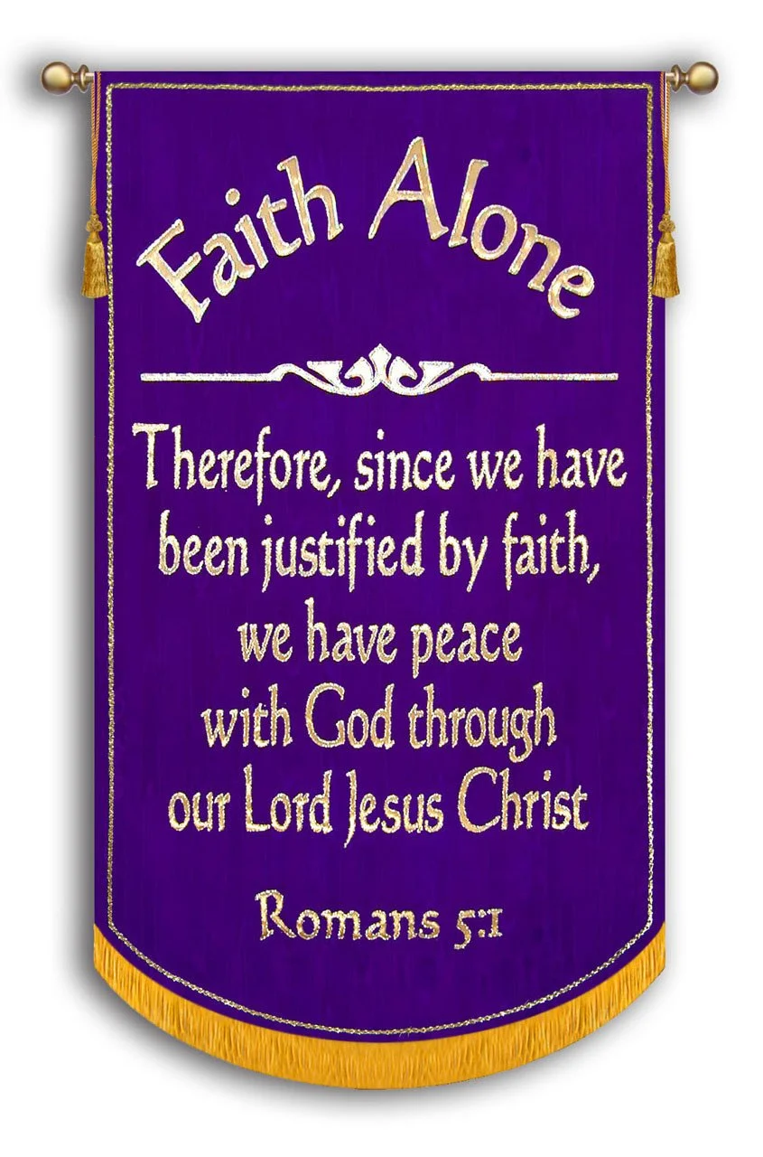 A purple fabric banner with gold trim and tassels, displaying a faith-based Bible verse from Romans 5:1 in gold text.