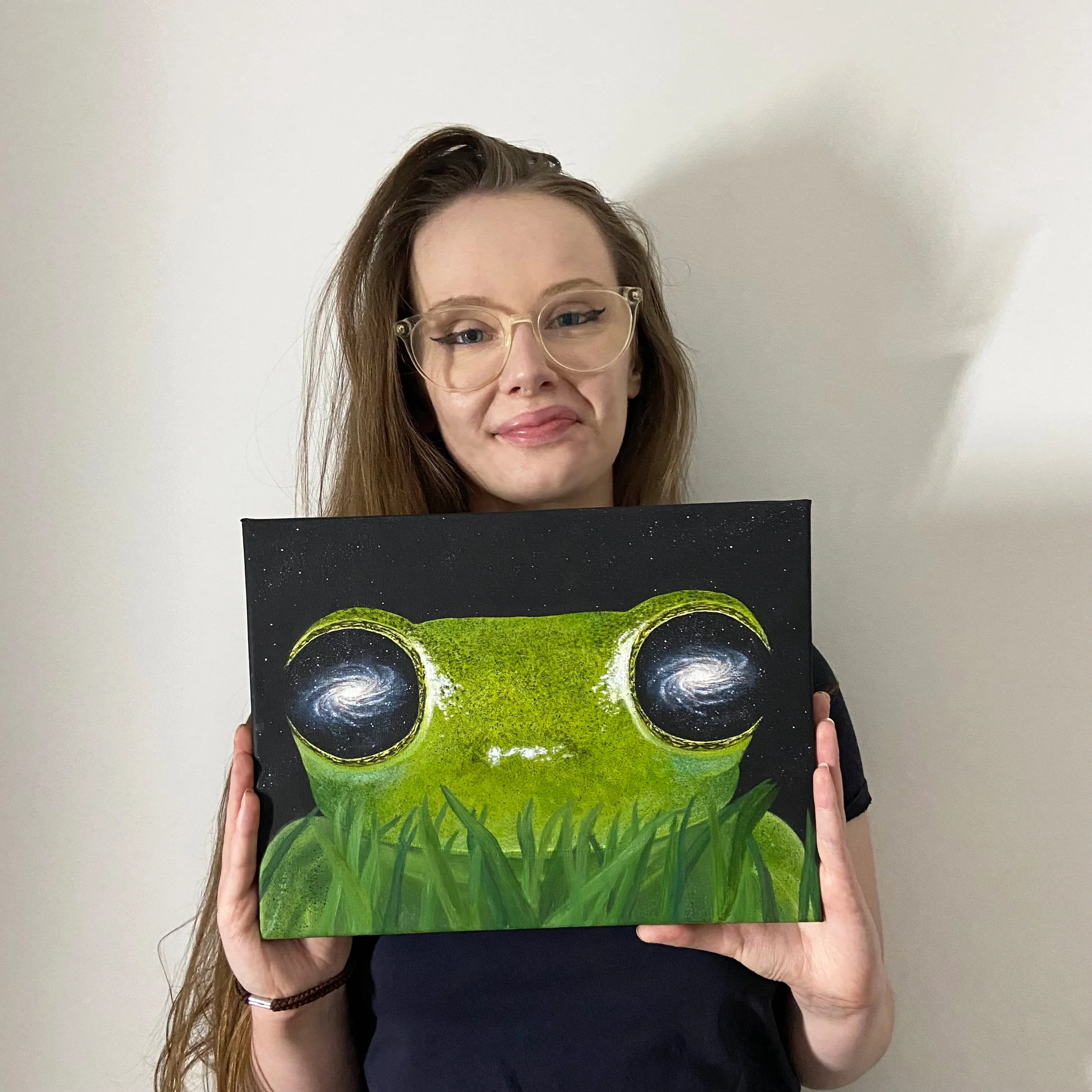 me holding galaxy eyed frog.jpg