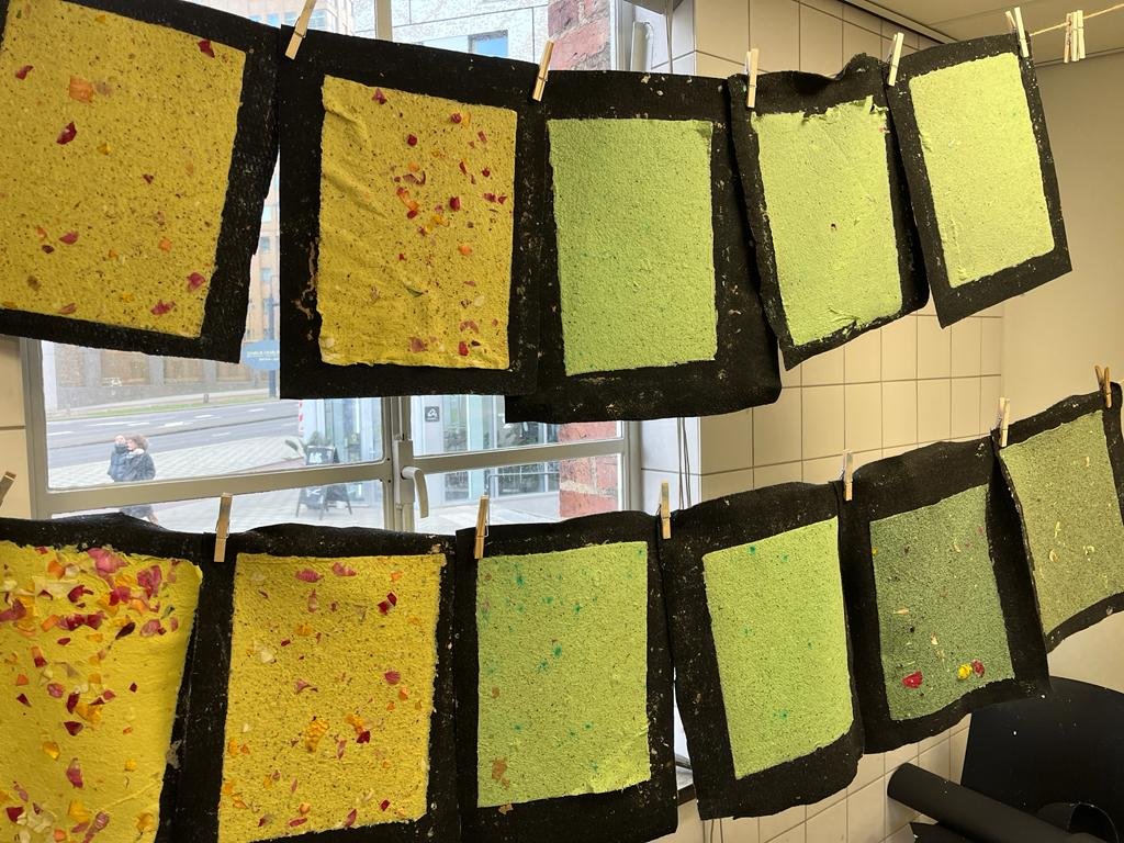Green and yellow papers with roses and rose leaves