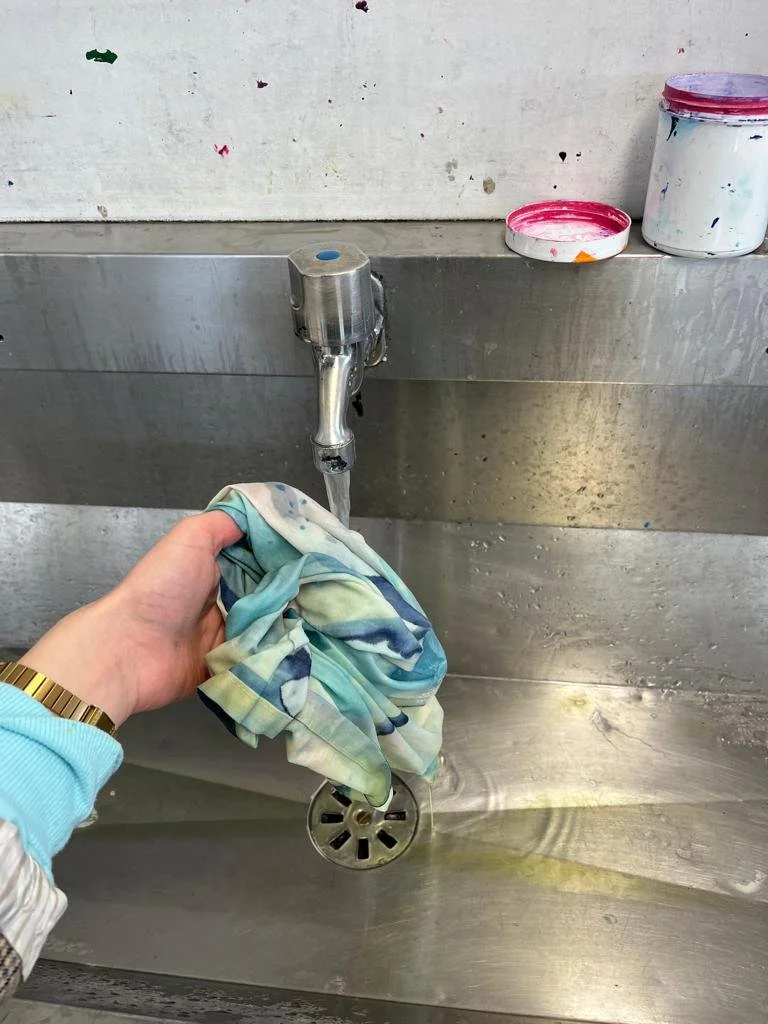 Washing off the chemicals from the cyanotype