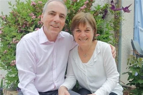 Alan and Valerie Kyle are seated in front of the camera. They are our mission partners in France.