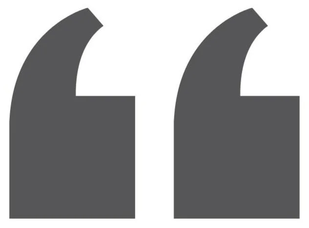 Two large, dark gray quotation marks on a white background.