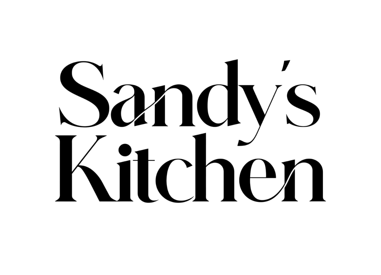 Black text on transparent background that reads, 'Sandy's Kitchen'.