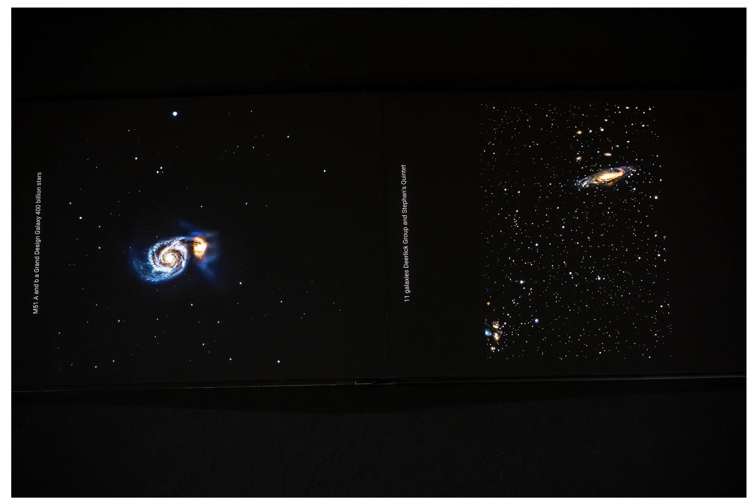 Two pages showing images of galaxies against a black background, with white text noting the names of the galaxies and groupings.