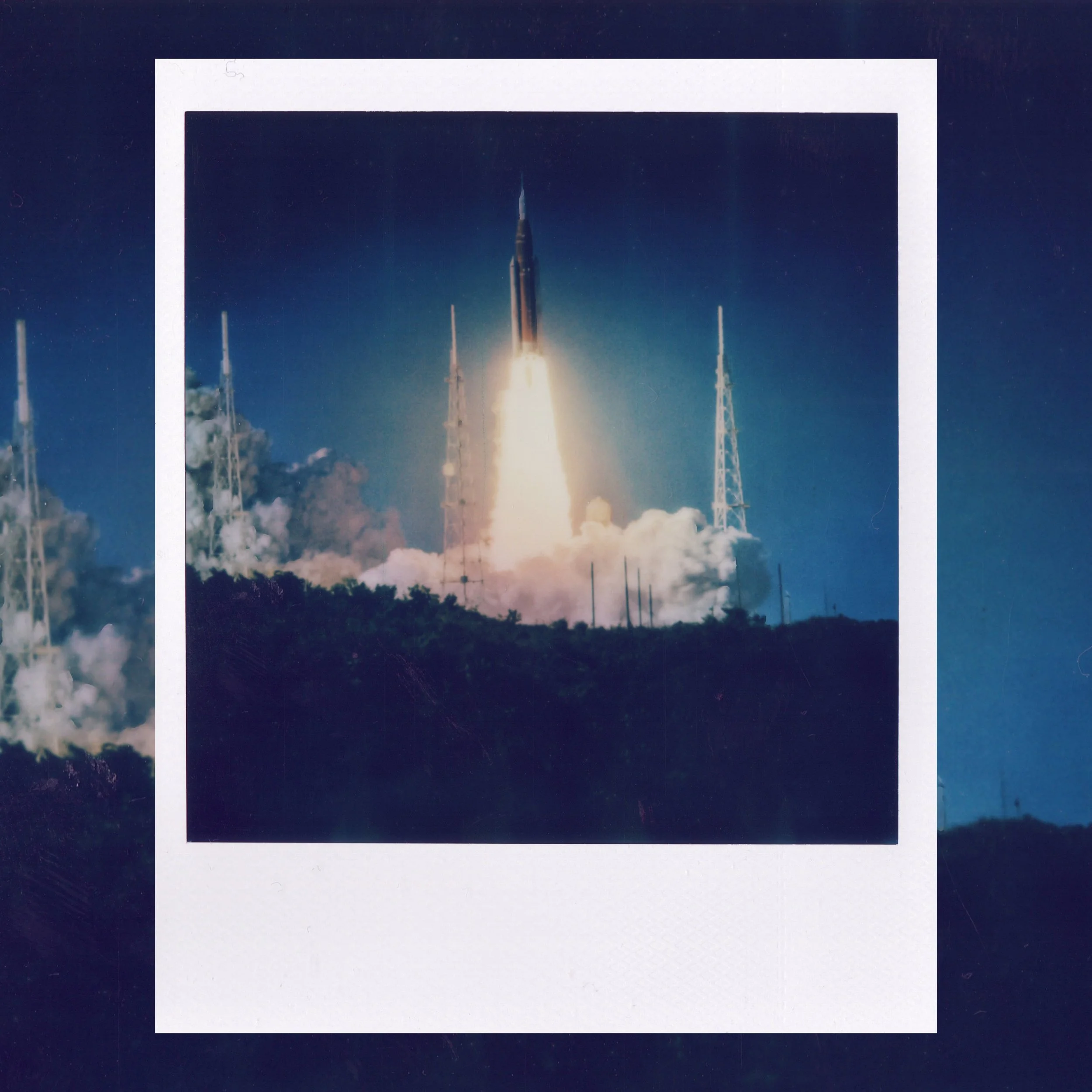 A rocket launches into the sky with flames and smoke coming from its base, with a dark night sky in the background.