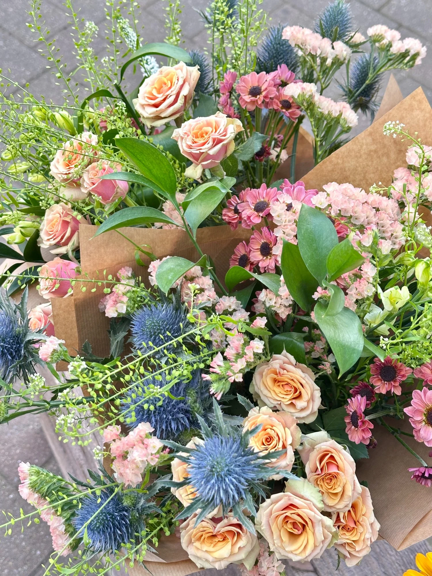 Close-up detail of a florist’s edit bouquet showing seasonal flowers and natural texture