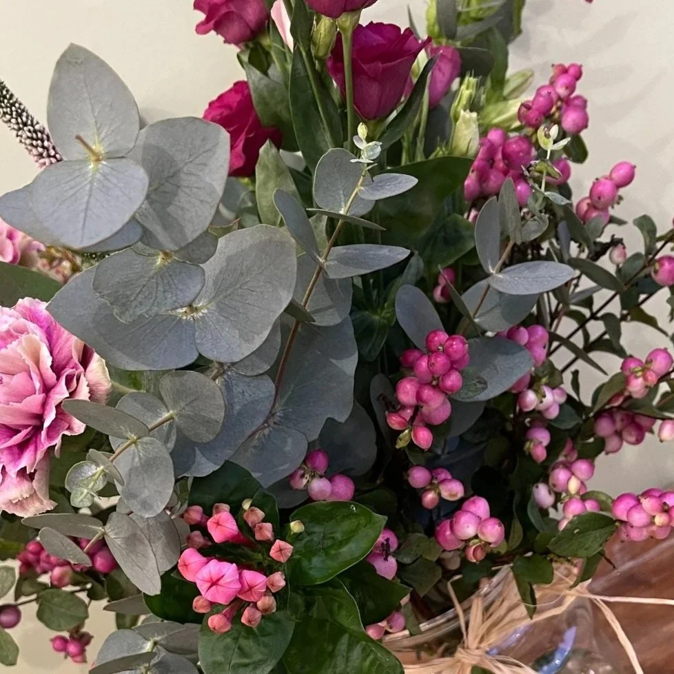 Close-up detail of Vicarage Lane bouquet showing soft pink seasonal flowers
