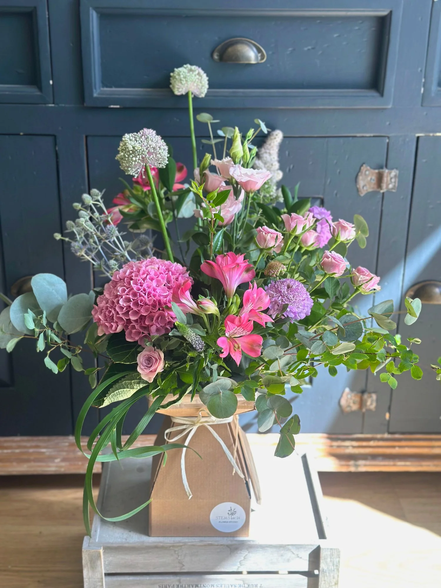 Vicarage Lane bouquet presented in a gift box with soft pink tones