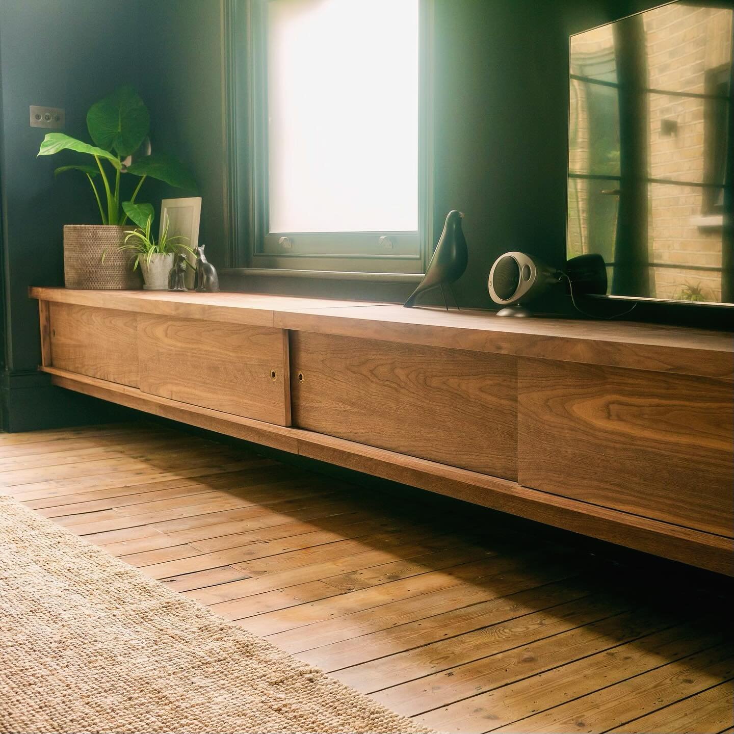 Wall to wall storage in Walnut veneer, measuring 4.1 metres end to end!  Featuring four separate storage spaces, with built in shelves, sliding doors and timeless brass handles. 

If you are looking for something similar, or have something specific i