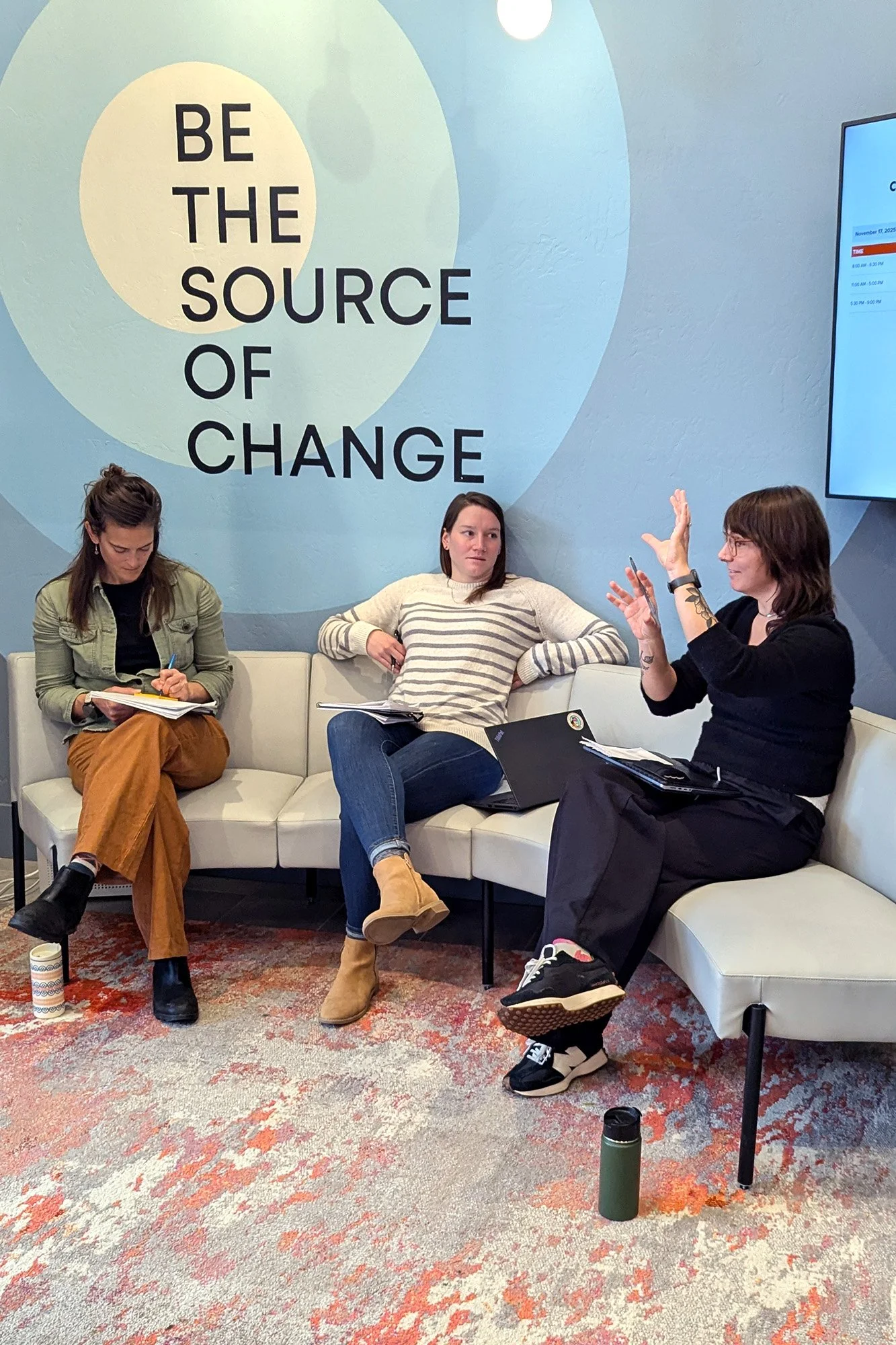 Christina Anabel (left), Lauren Costa (center), and Kayla McCormick (right) in discussion during the strategic planning session.