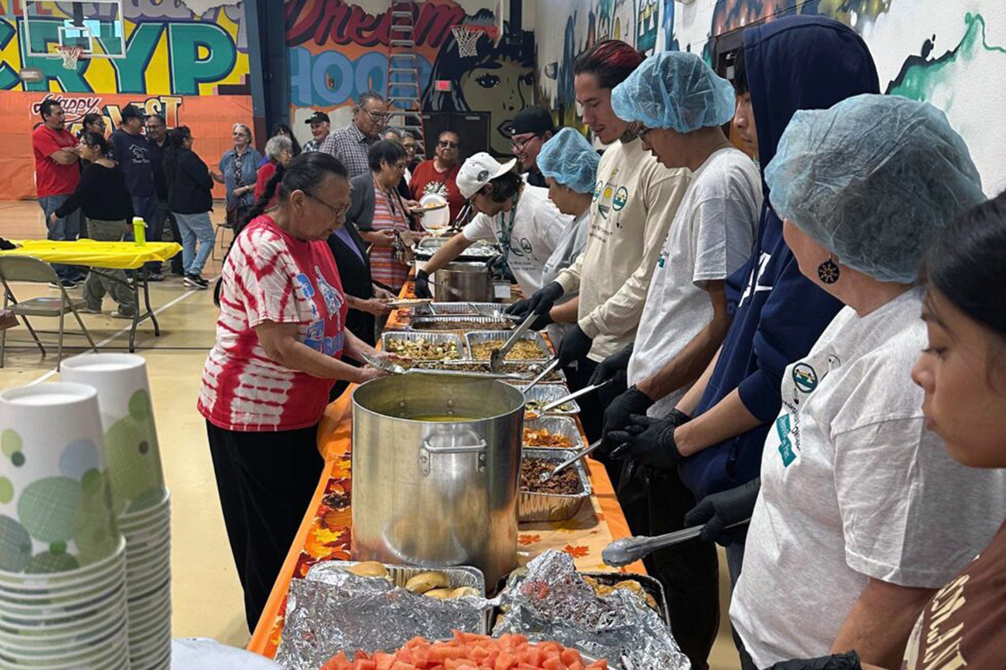 Lakota youth serve food at a harvest festival on the Cheyenne River Reservation.