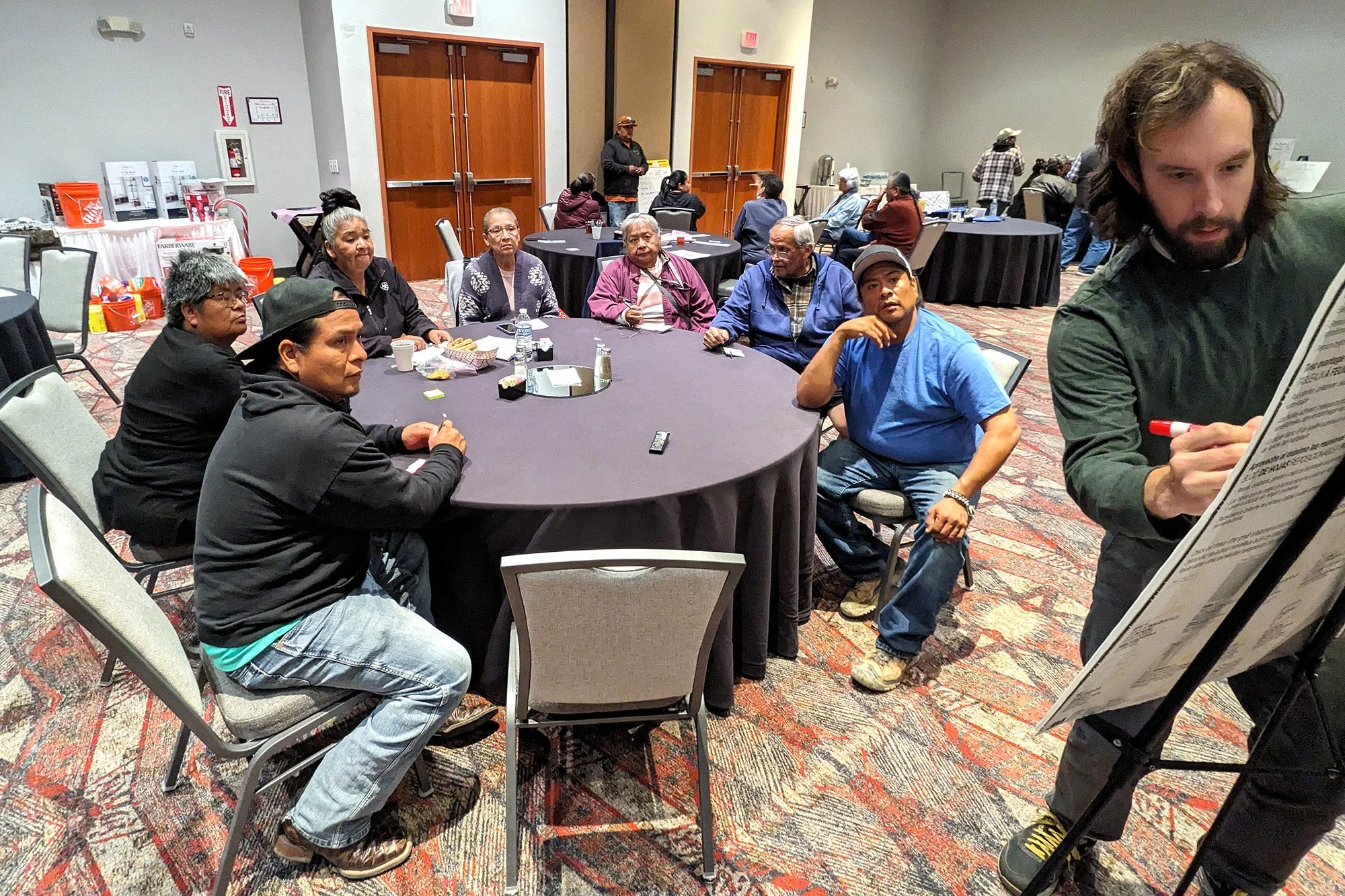 Max Van Oostenburg, associate research director,  leads an activity at a community meal with Laguna Pueblo in New Mexico.