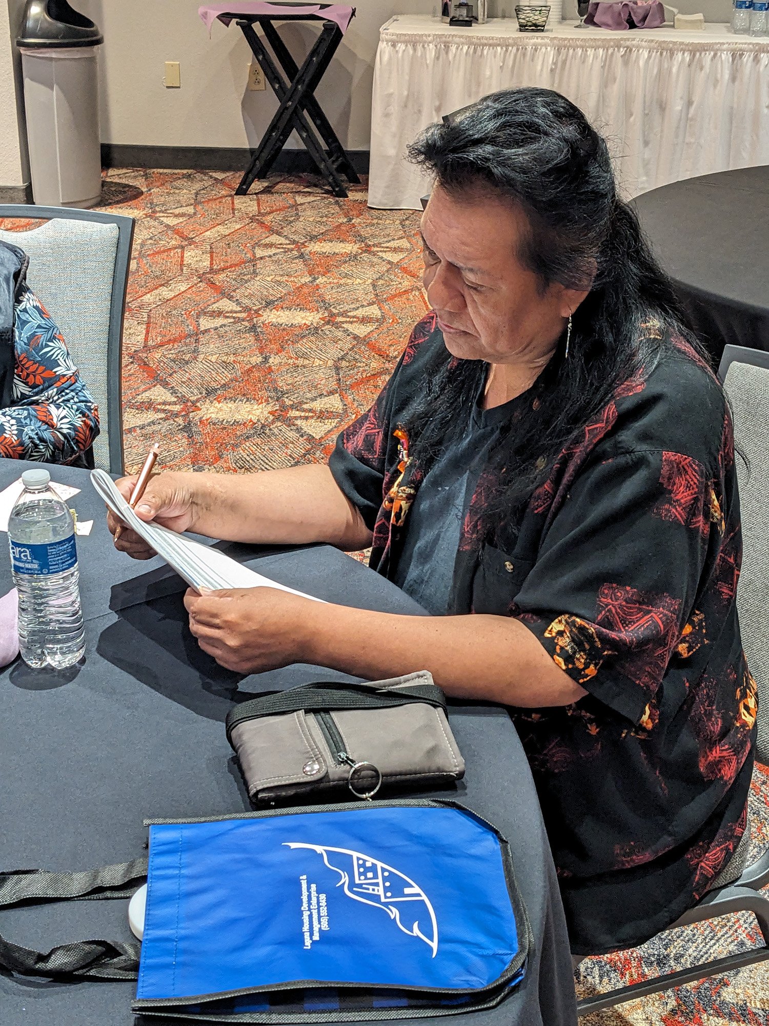 Laguna community member completes a housing survey.