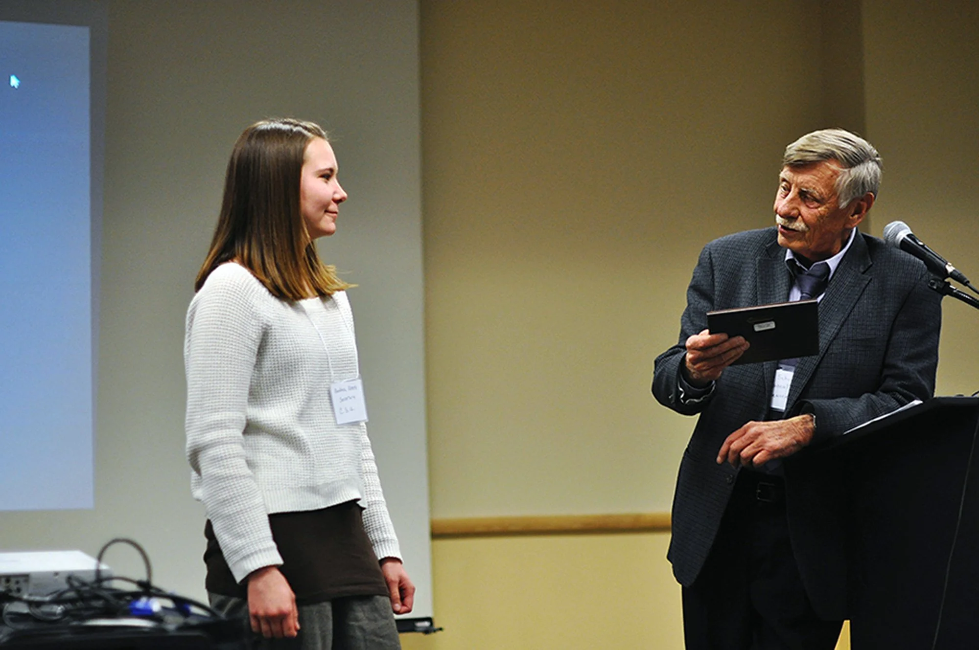 Andrea receives an award from Dr. Jack Schultz, High Plains Society for Applied Anthropology, for her role as managing editor of The Applied Anthropologist.