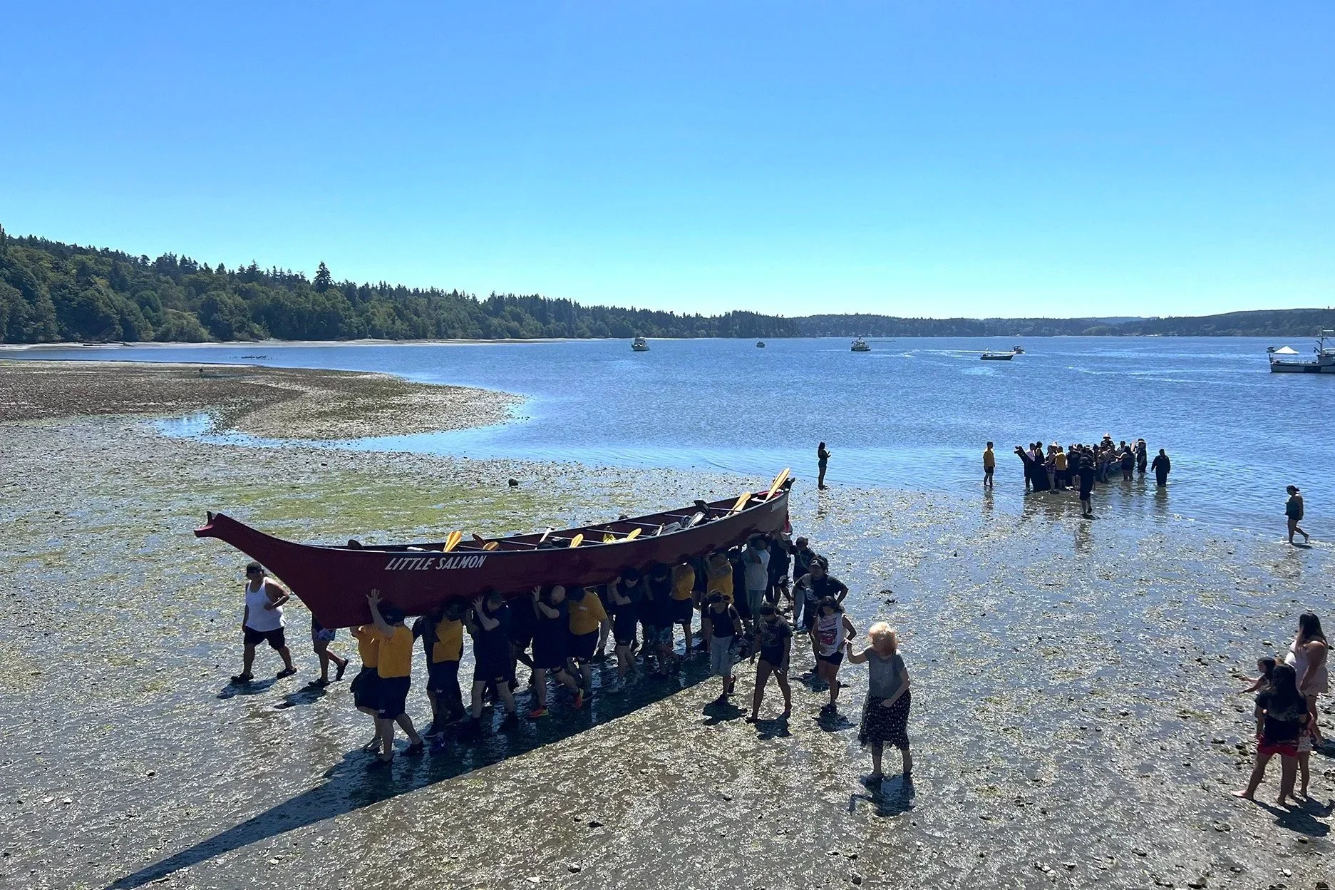 Tribal members carry a canoe in Washington.