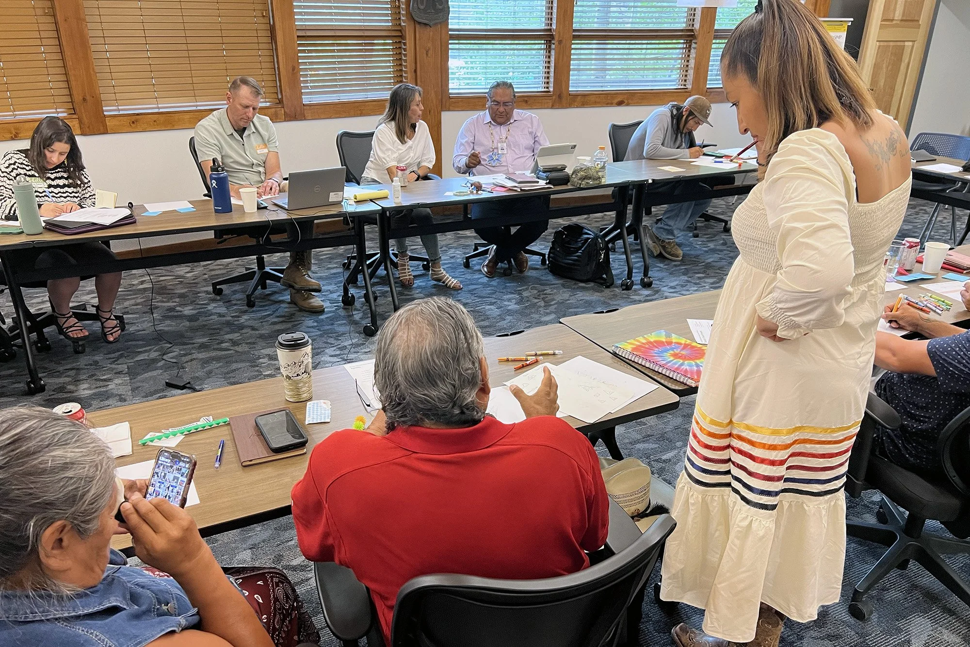 Workshop participants create their own sign ideas at the Clear Creek Ranger District Office in Idaho Springs in July 2025.