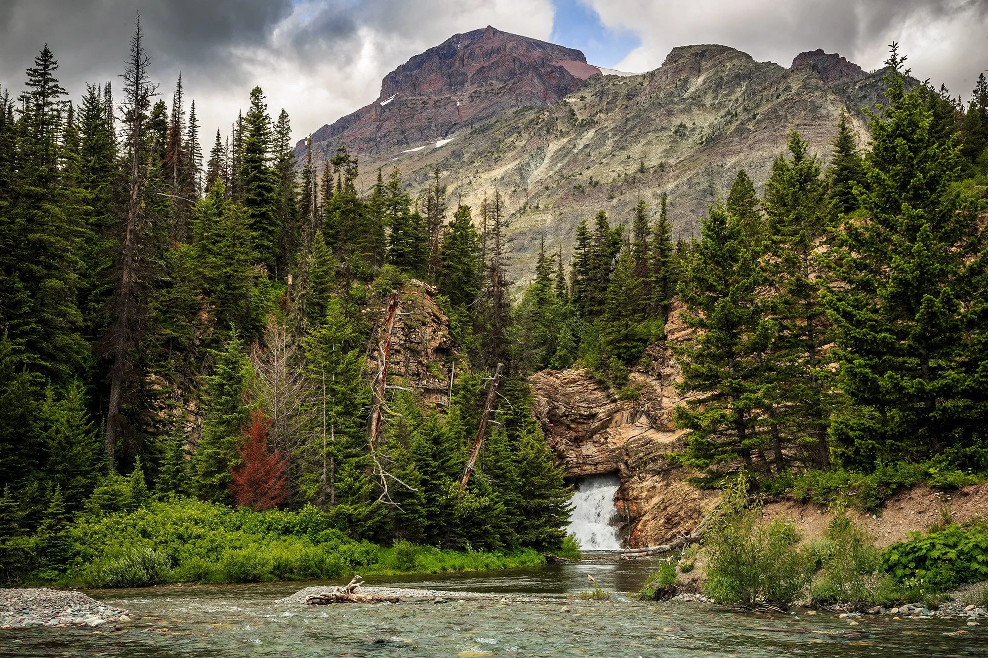Running Eagle Falls, a sacred waterfall named after Pitamakan, a female warrior of the Blackfeet Tribe.