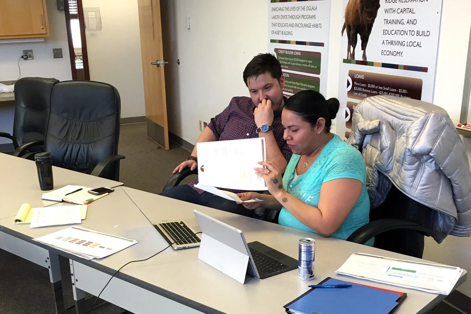Josh works with staff at Lakota Funds in Kyle, South Dakota, in 2016.