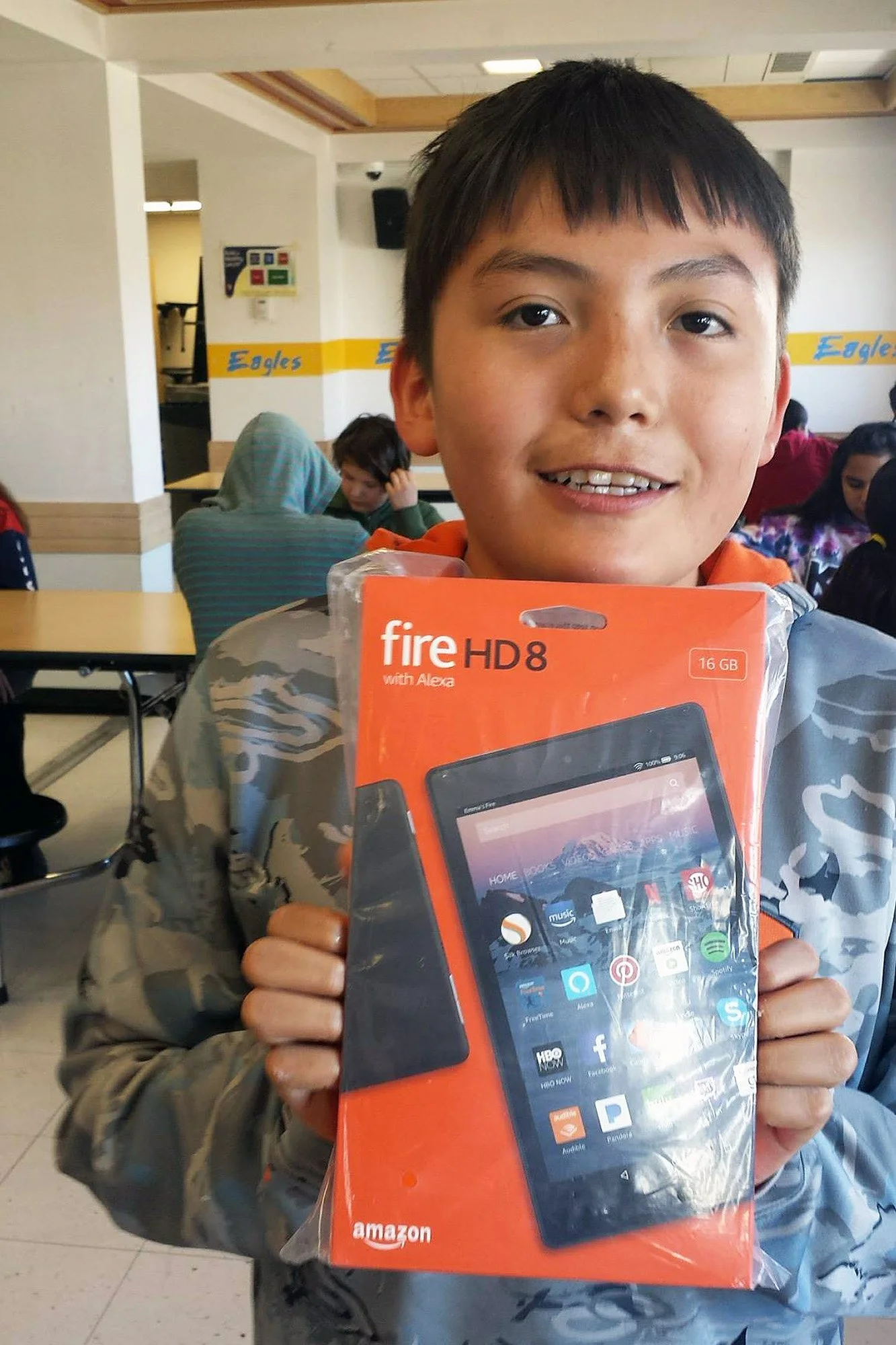 Shannon Bear Medicine, now NACDC’s Mini-Bank intern, won an Amazon Kindle after his name was drawn in a monthly deposit drawing in fourth grade.